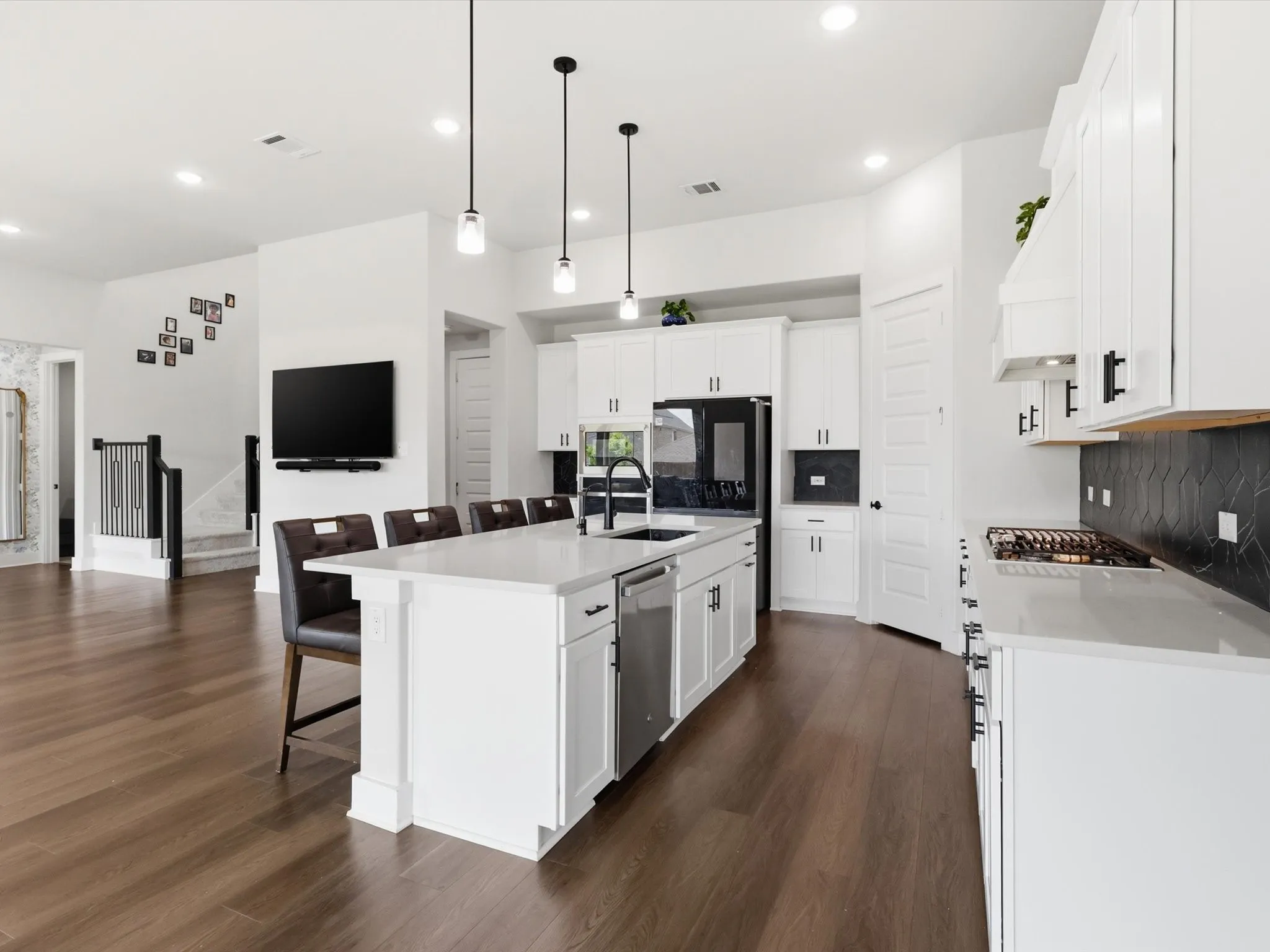 Seamless kitchen-to-living flow with abundant natural light