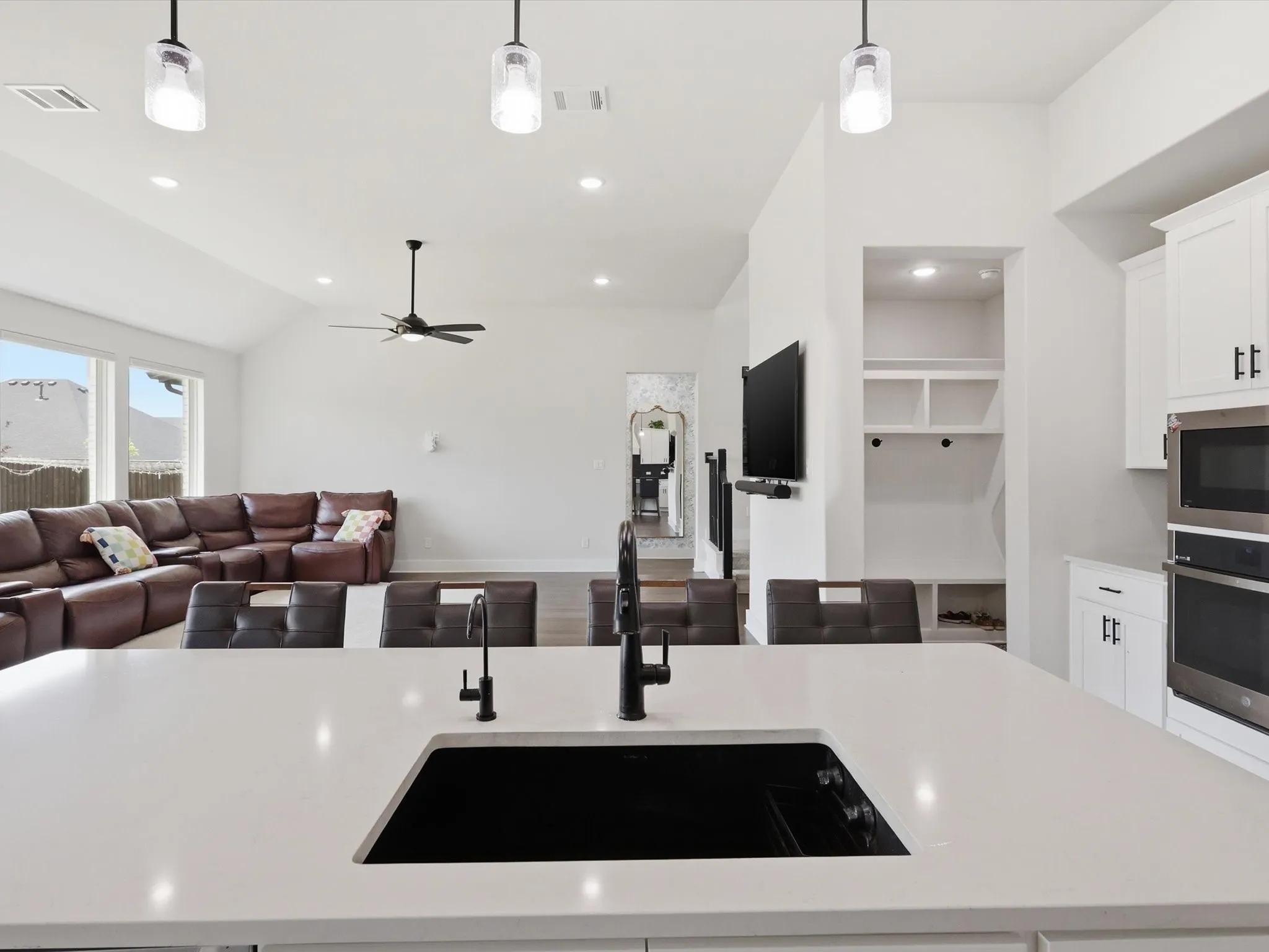 Seamless kitchen-to-living flow with abundant natural light