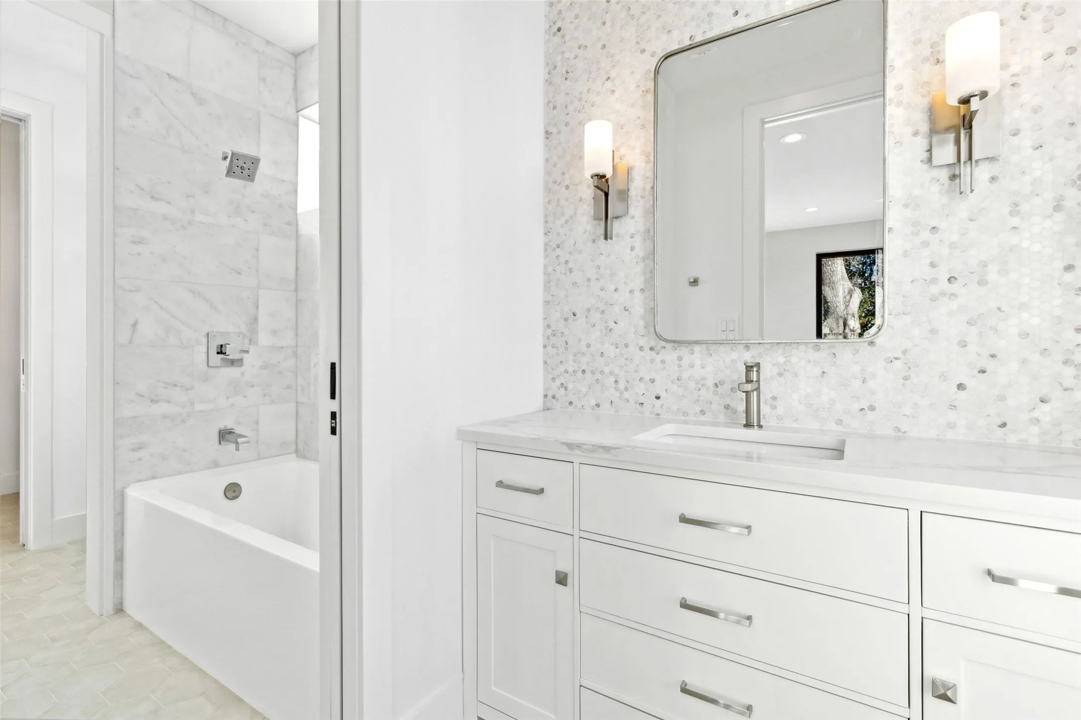 Jack and Jill bathroom with tub-shower combo, dual access, and sleek, modern finishes.