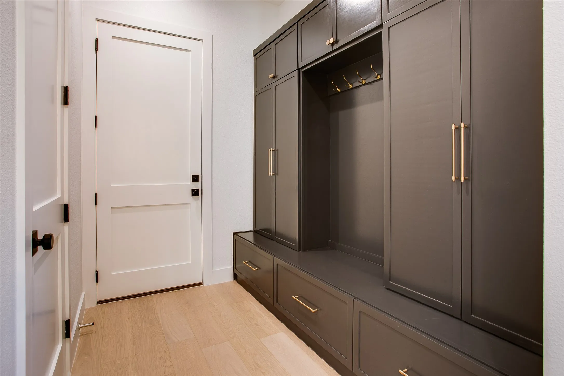 Mud Room with extensive storage right off the garage and pantry.