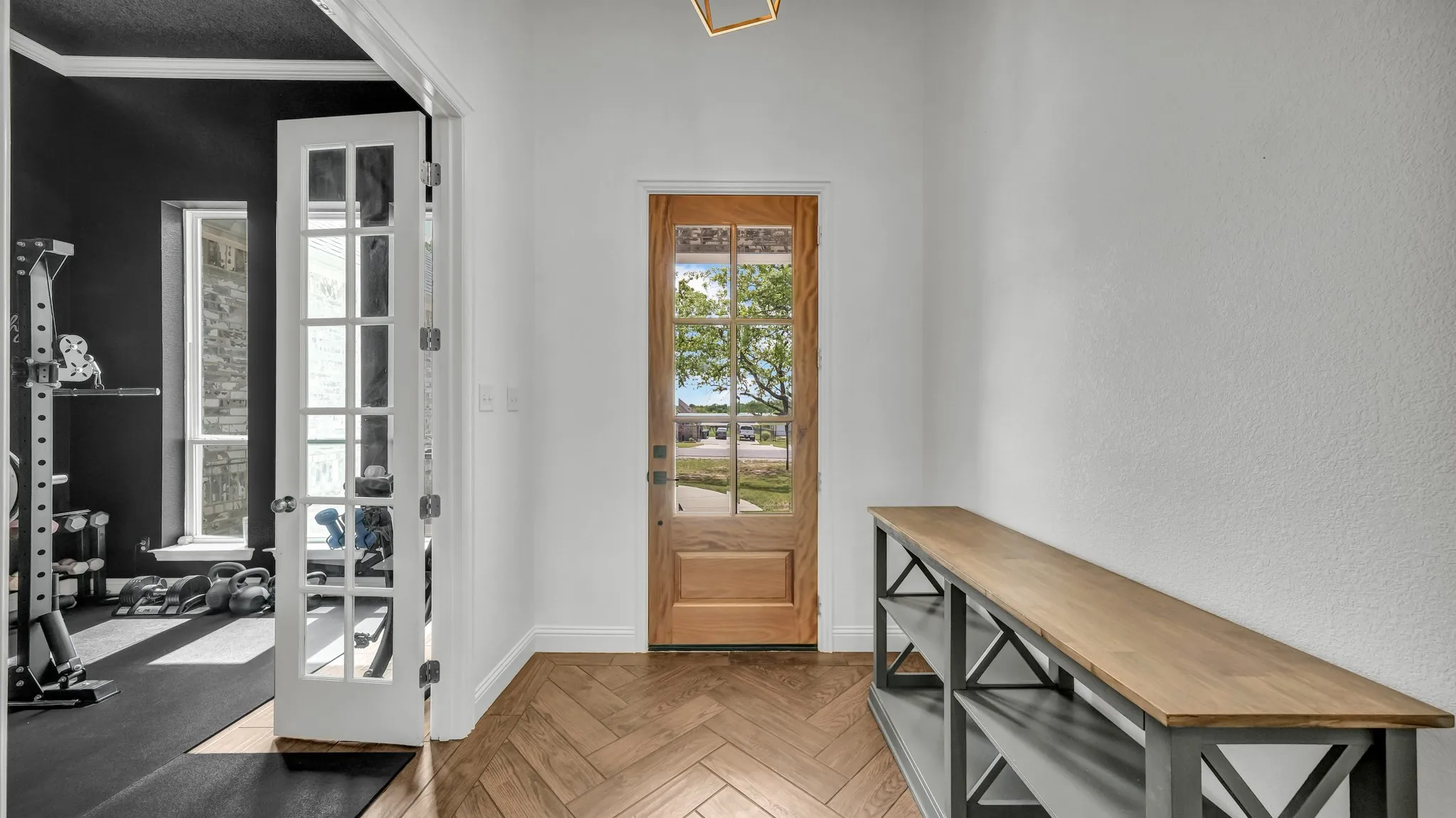 Entryway featuring parquet floors and crown molding
