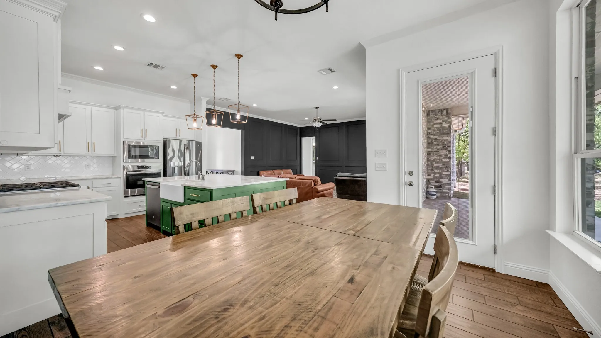 Dining room with dark wood-style floors, recessed lighting, and a ceiling fan