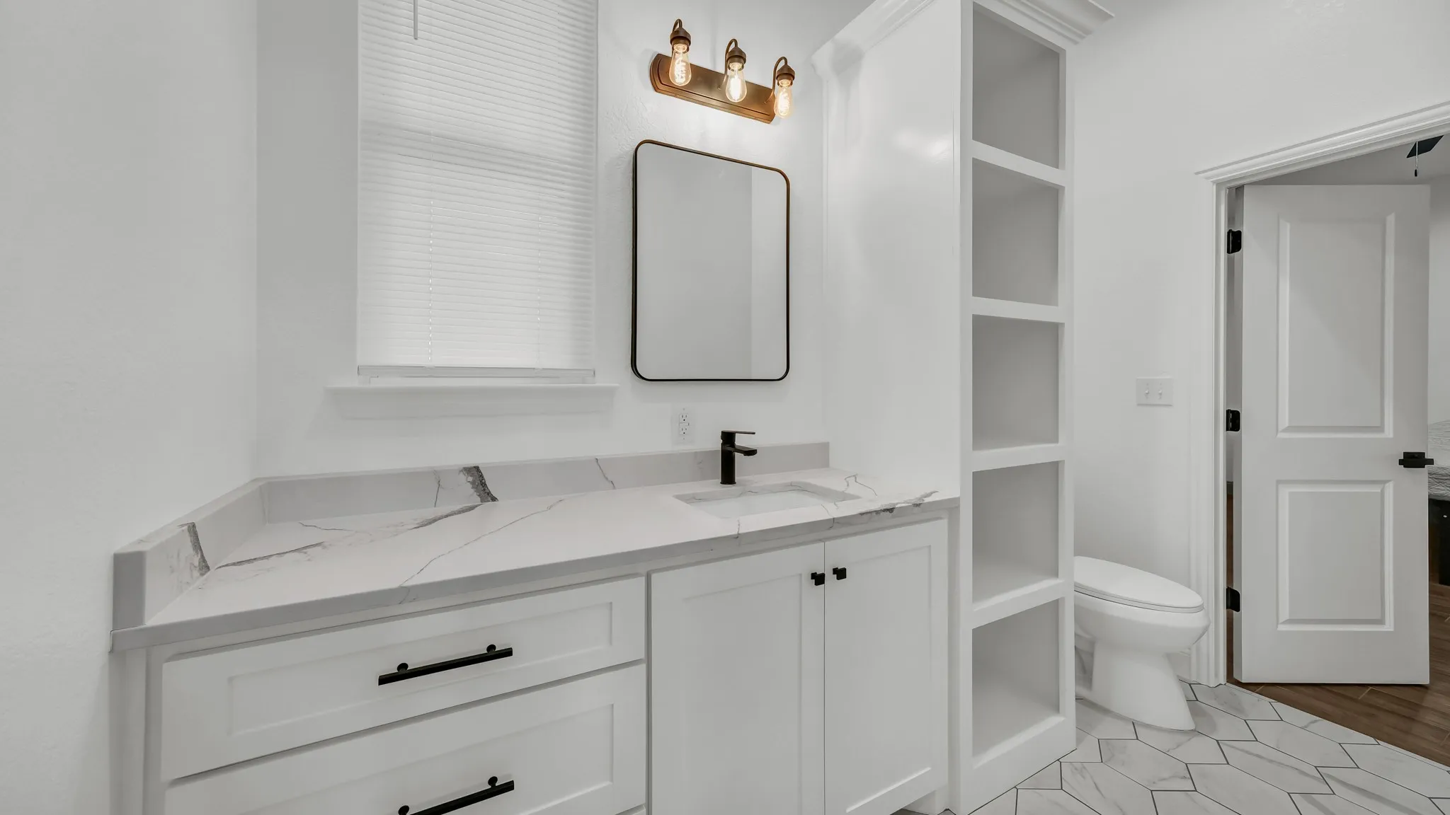 Bathroom featuring vanity and toilet