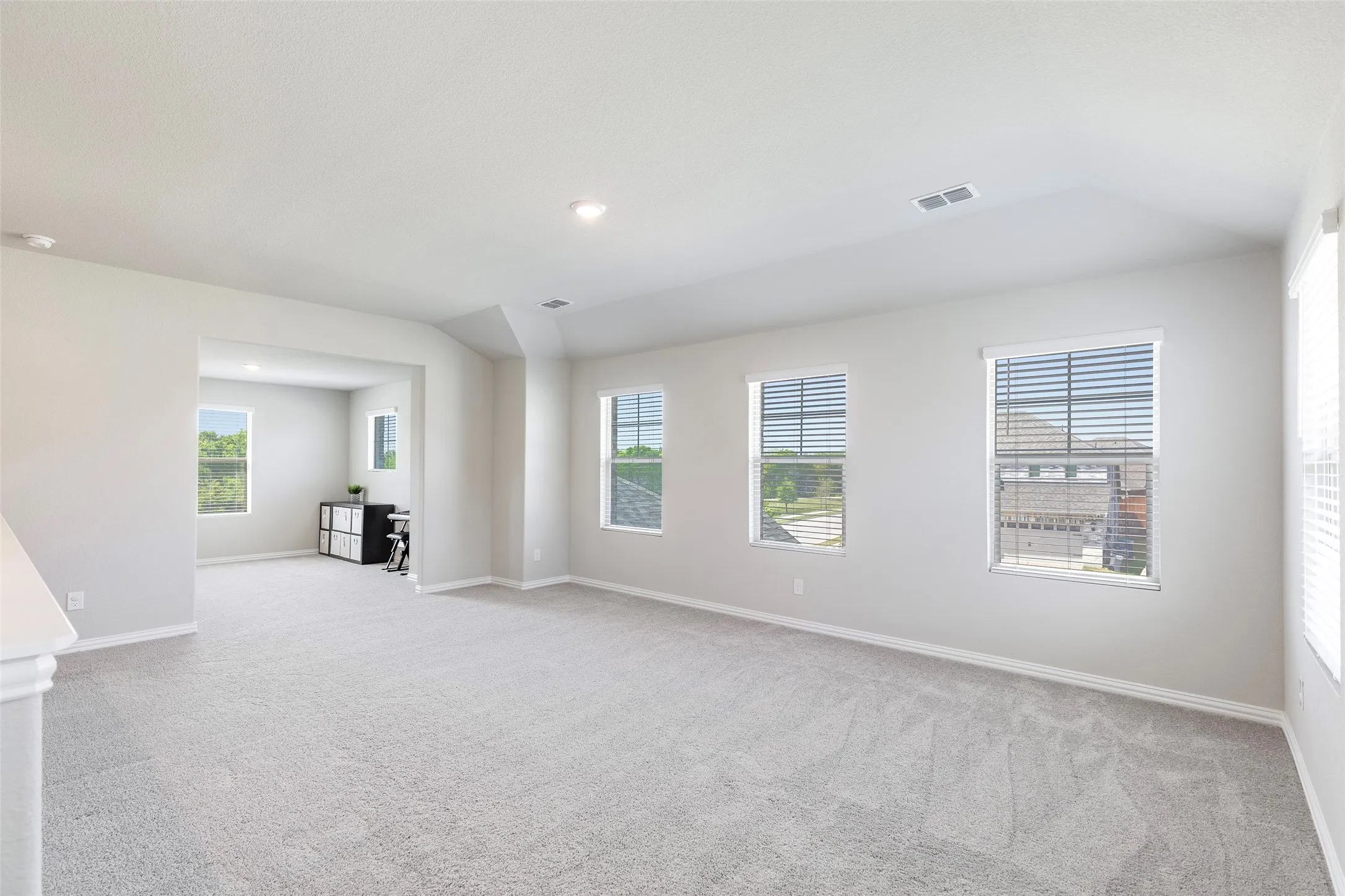 Upstairs, the home opens into a spacious second living area designed for flexibility.
Whether used as a game room, media space, or additional lounge, it offers room to truly spread out.