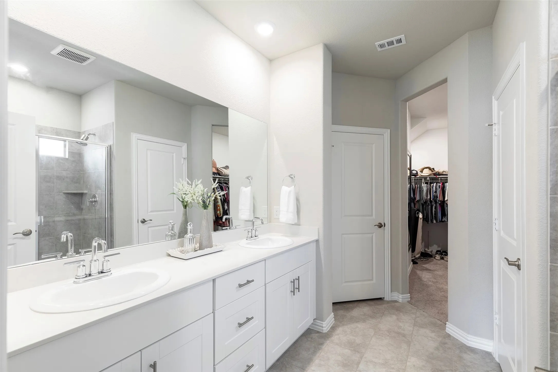 Clean, bright ensuite with oversized walk in shower. Beyond it all, the extra-large walk-in closet gives you the storage every primary suite should have.