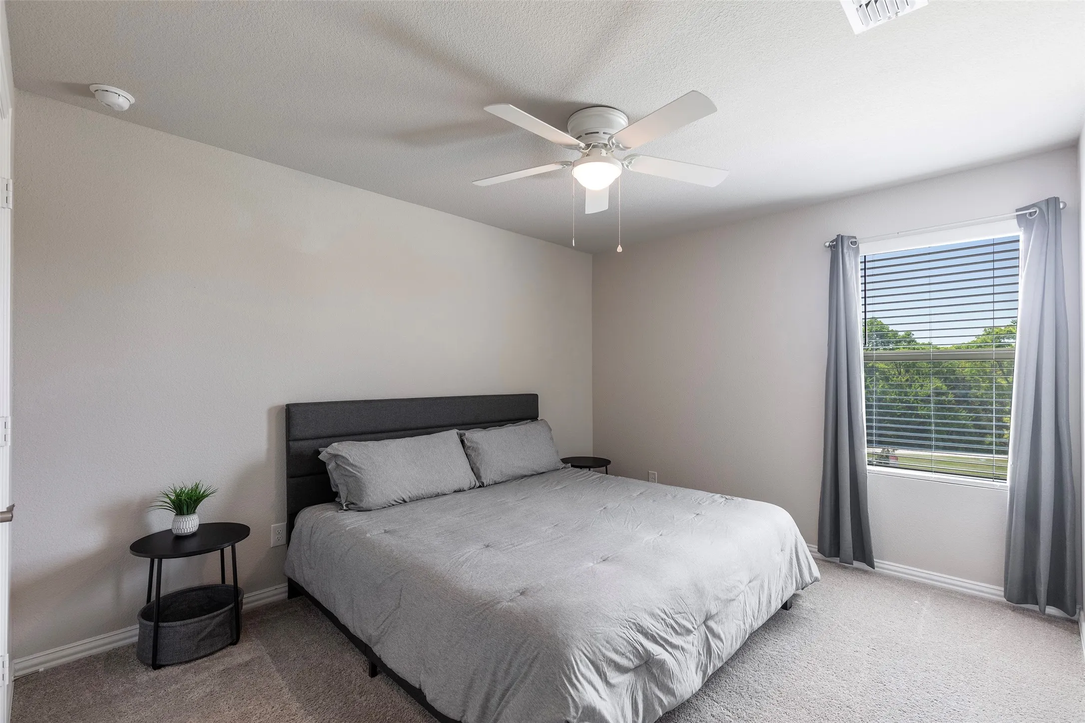 2nd Comfortable and large secondary bedroom with soft natural light.