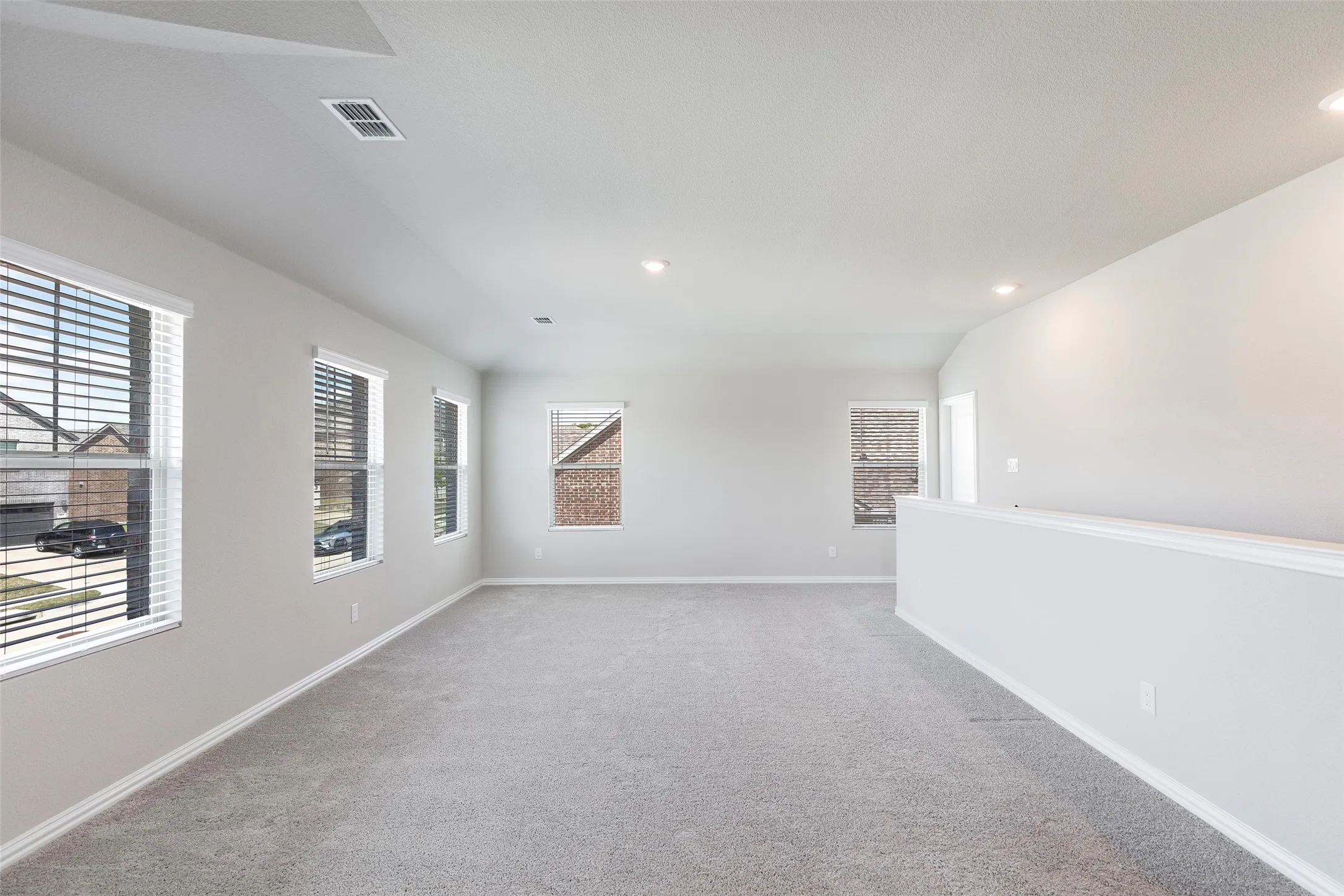 Upstairs living area thoughtfully separated from the main-level primary suite.