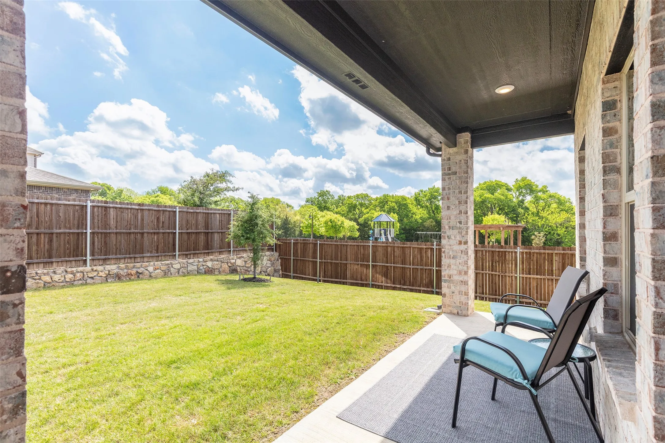 Private backyard with open green space and room to expand.