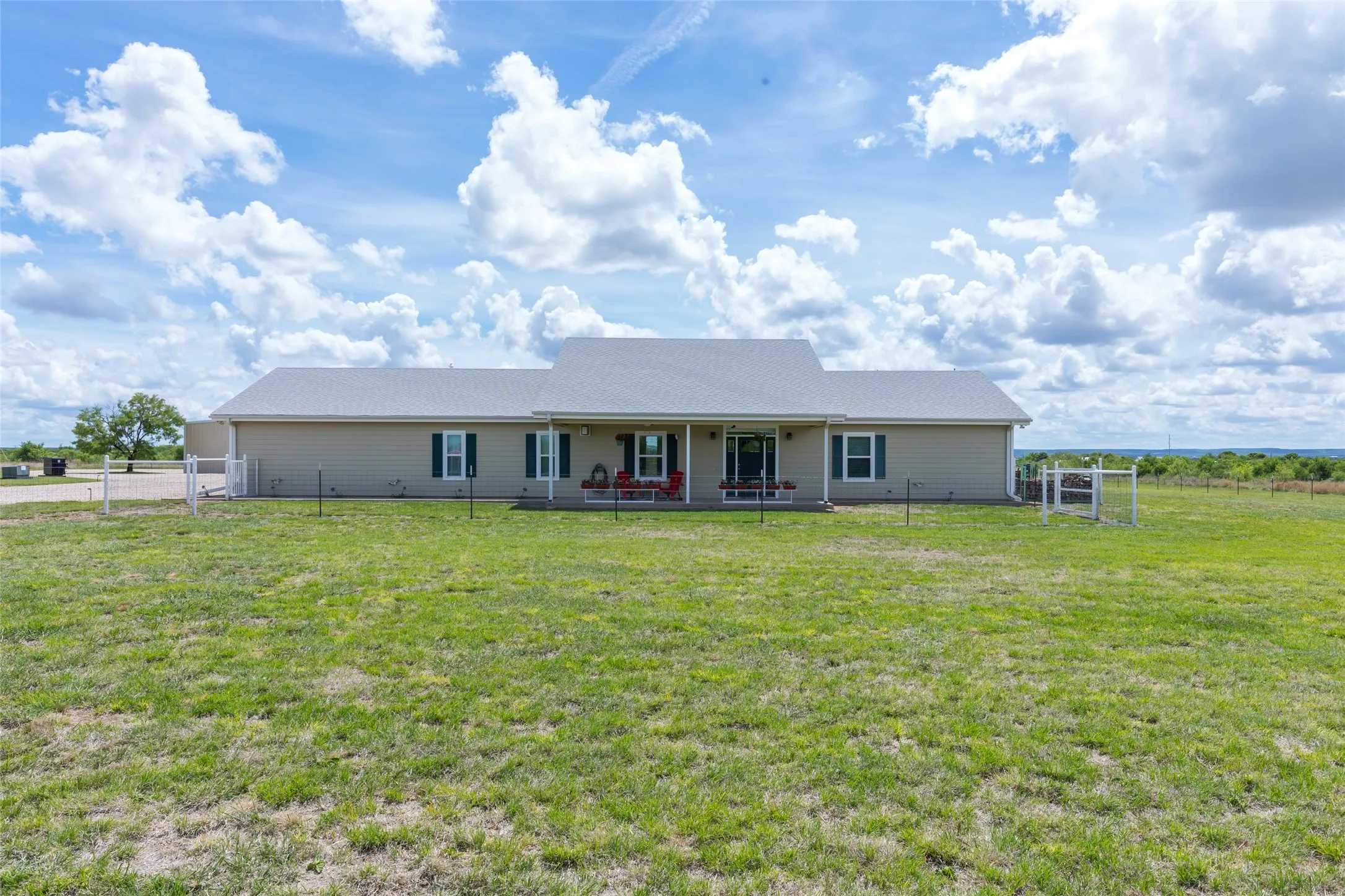 Main home with fenced off front yard perfect for the pets