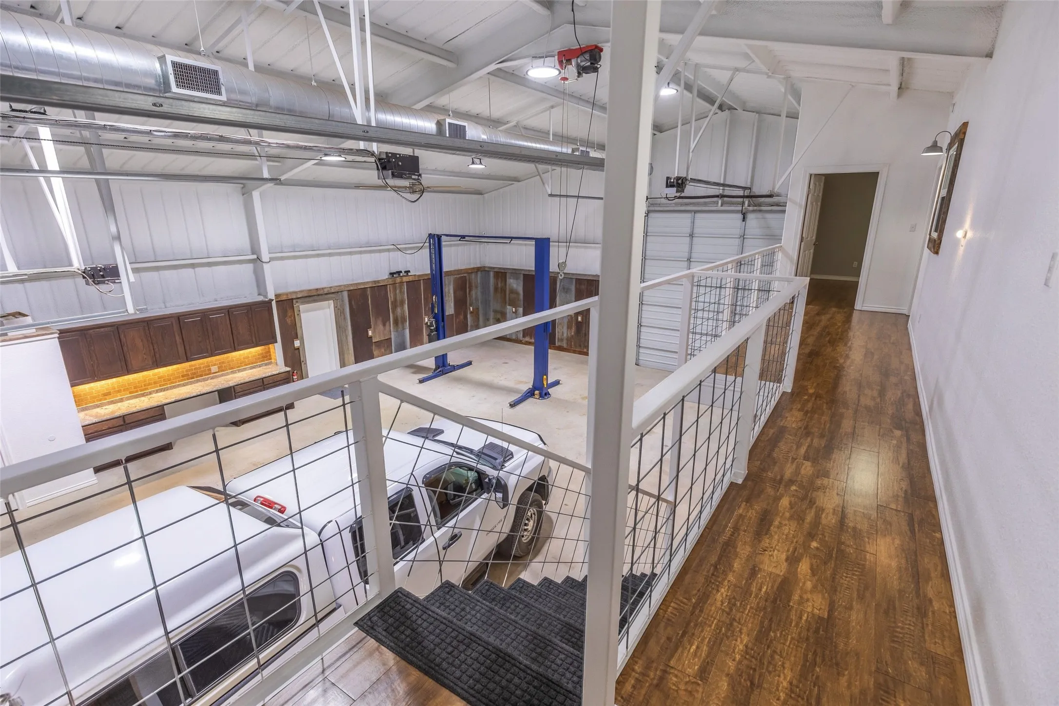 Upstairs in the warehouse/man mansion. 3 rooms with walk-in closets and built in storage cabinetry. Full bathroom also located on top floor