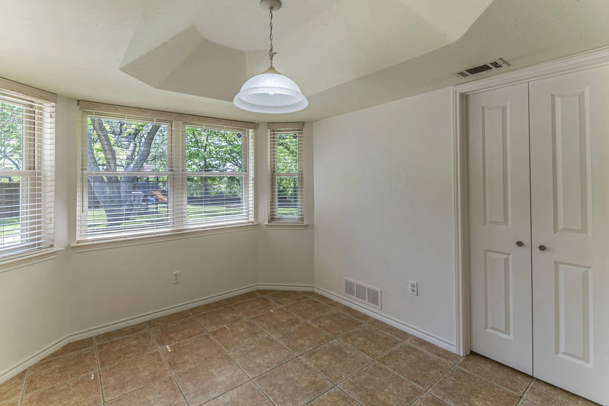 Unfurnished dining area with baseboards