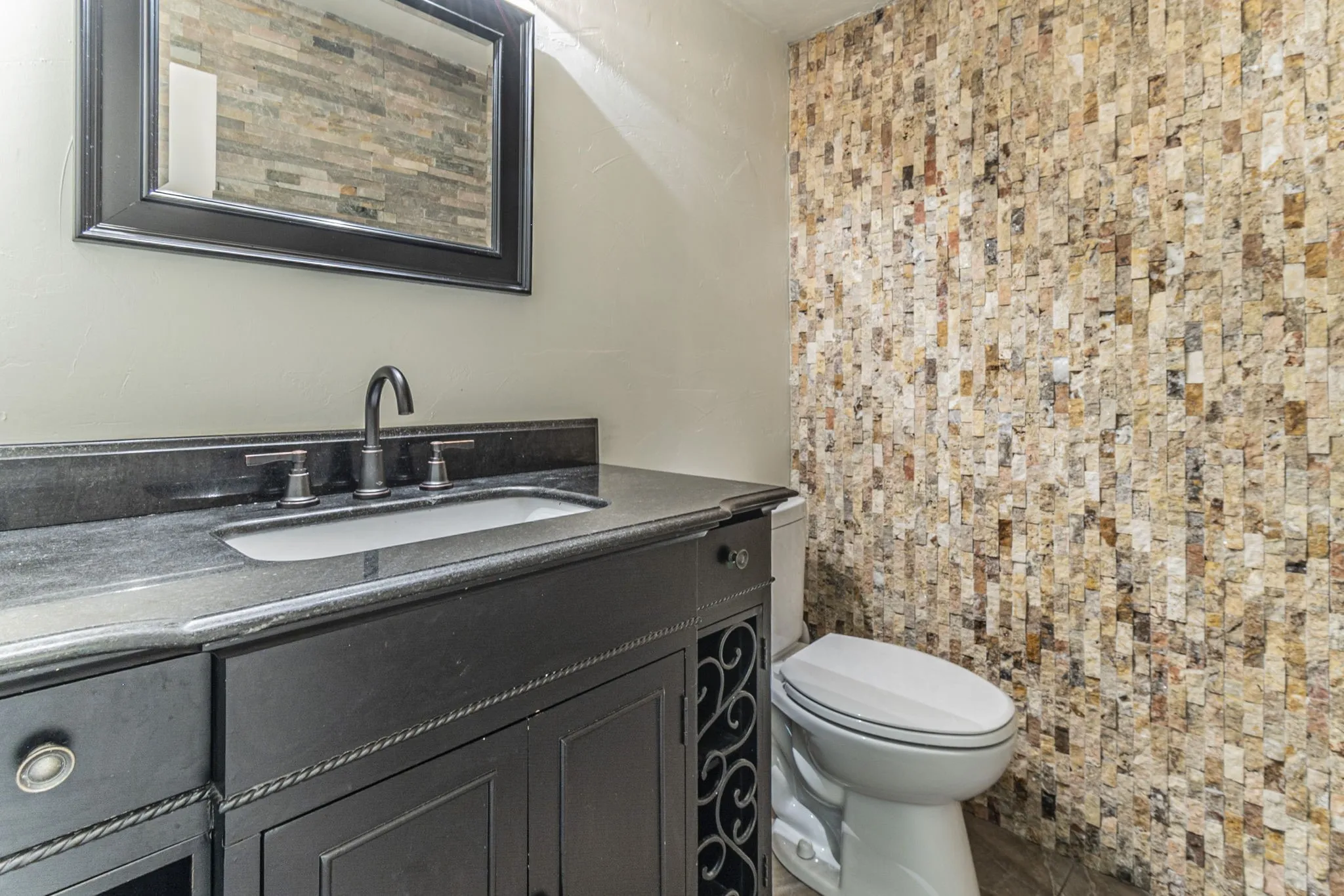 Half bath with vanity and toilet