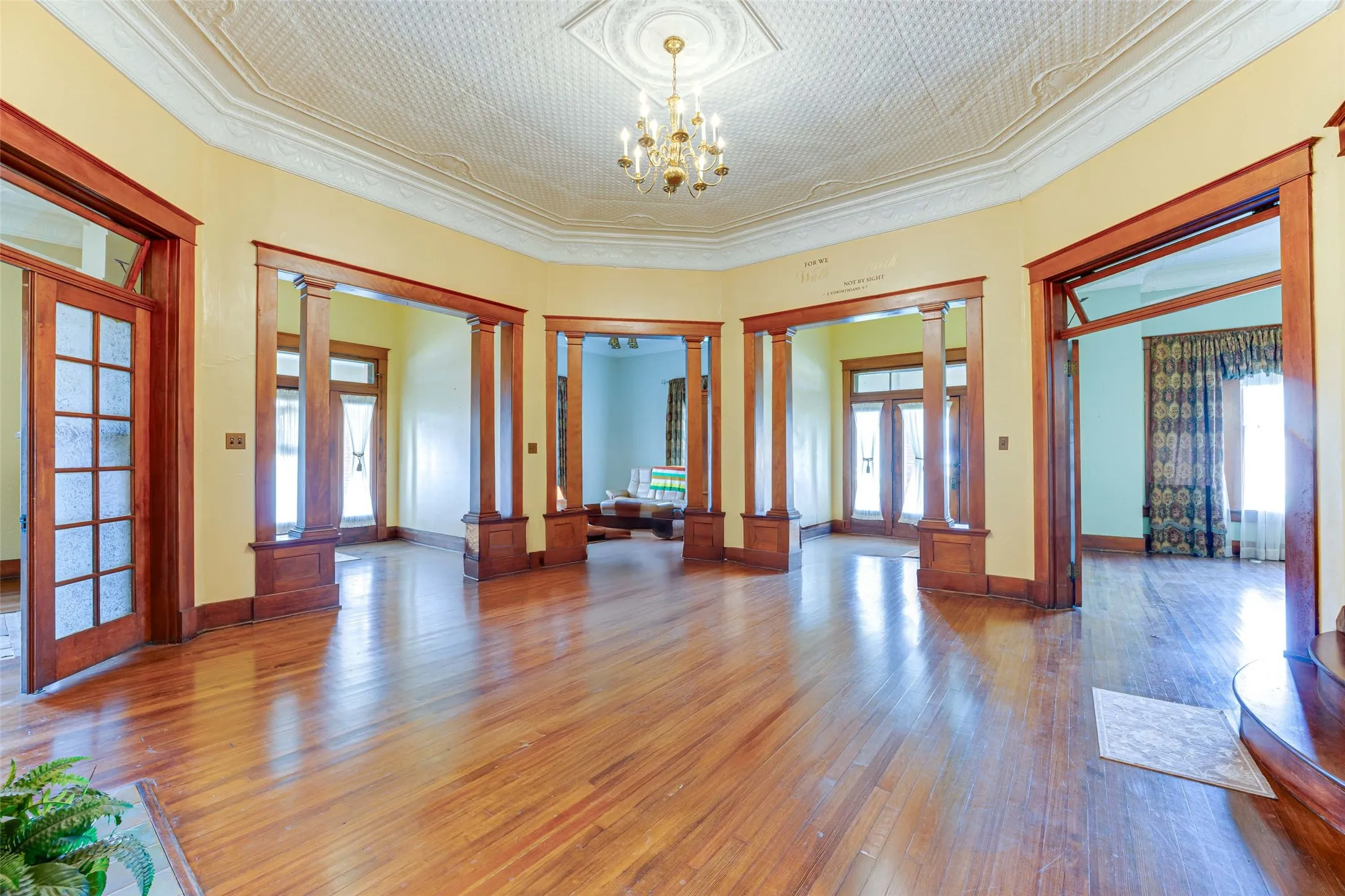 View of Front Entry Door, Living Room, Side Entry Door, and Dining Room in Rotunda
