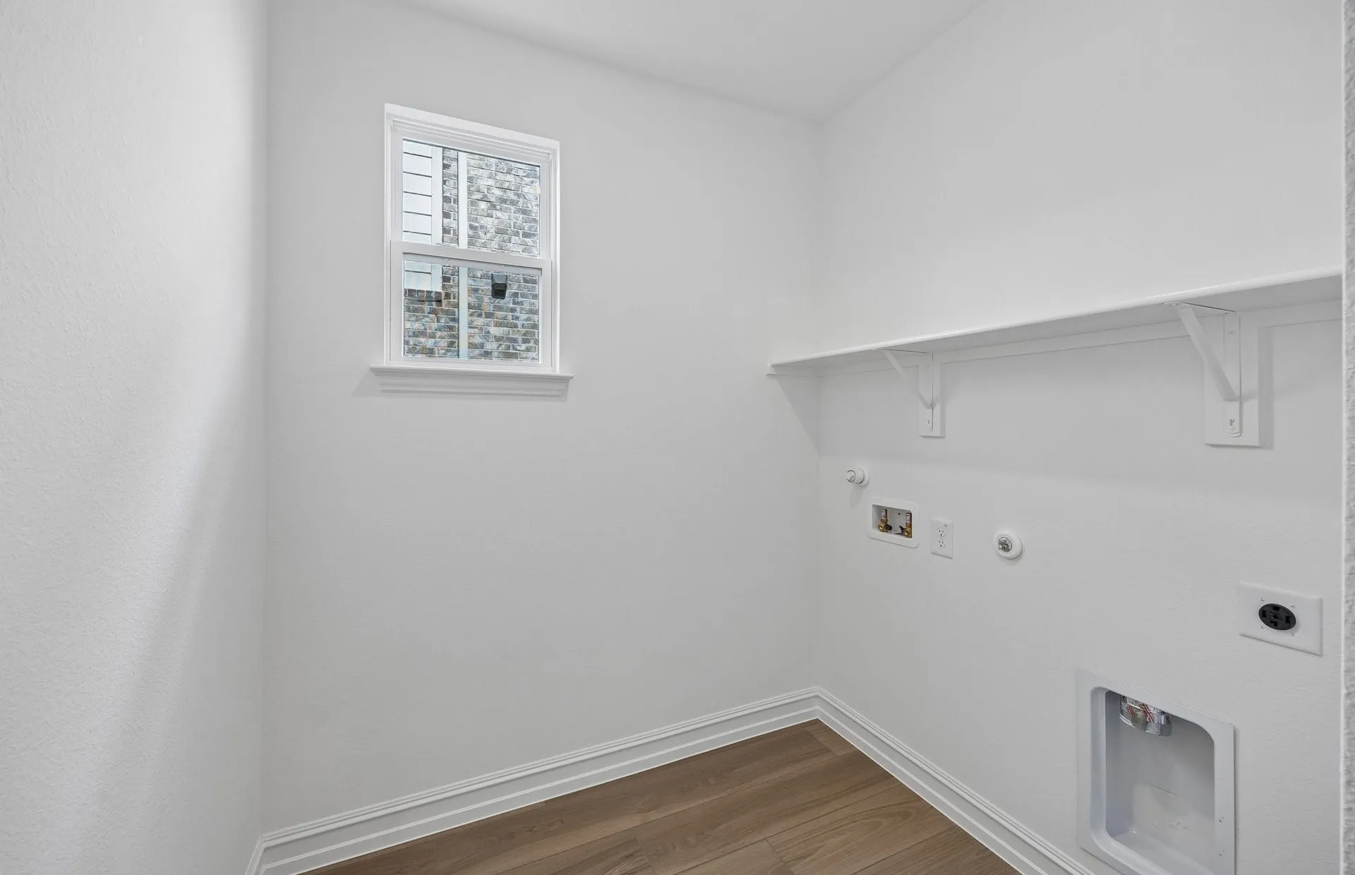 Laundry room with built-in shelving