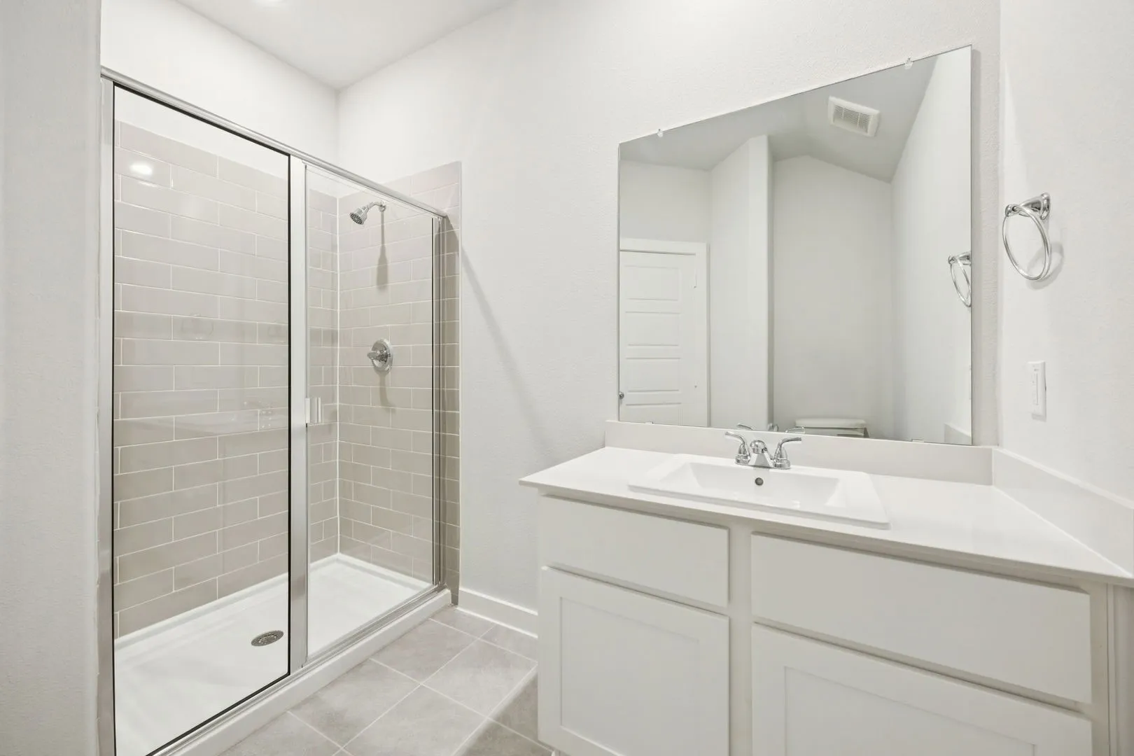 Bathroom in the Masters home plan by Trophy Signature Homes – REPRESENTATIVE PHOTO