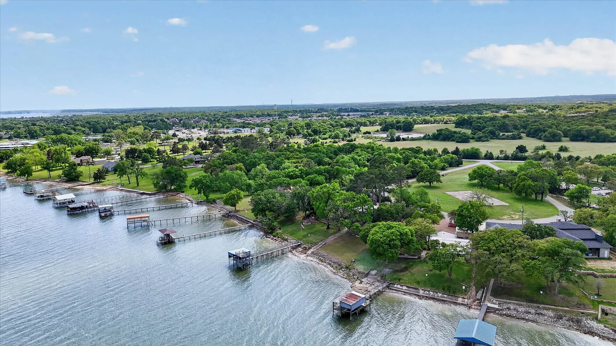 Bird's eye view of Eagle Mountain Lake and a tree filled landscape