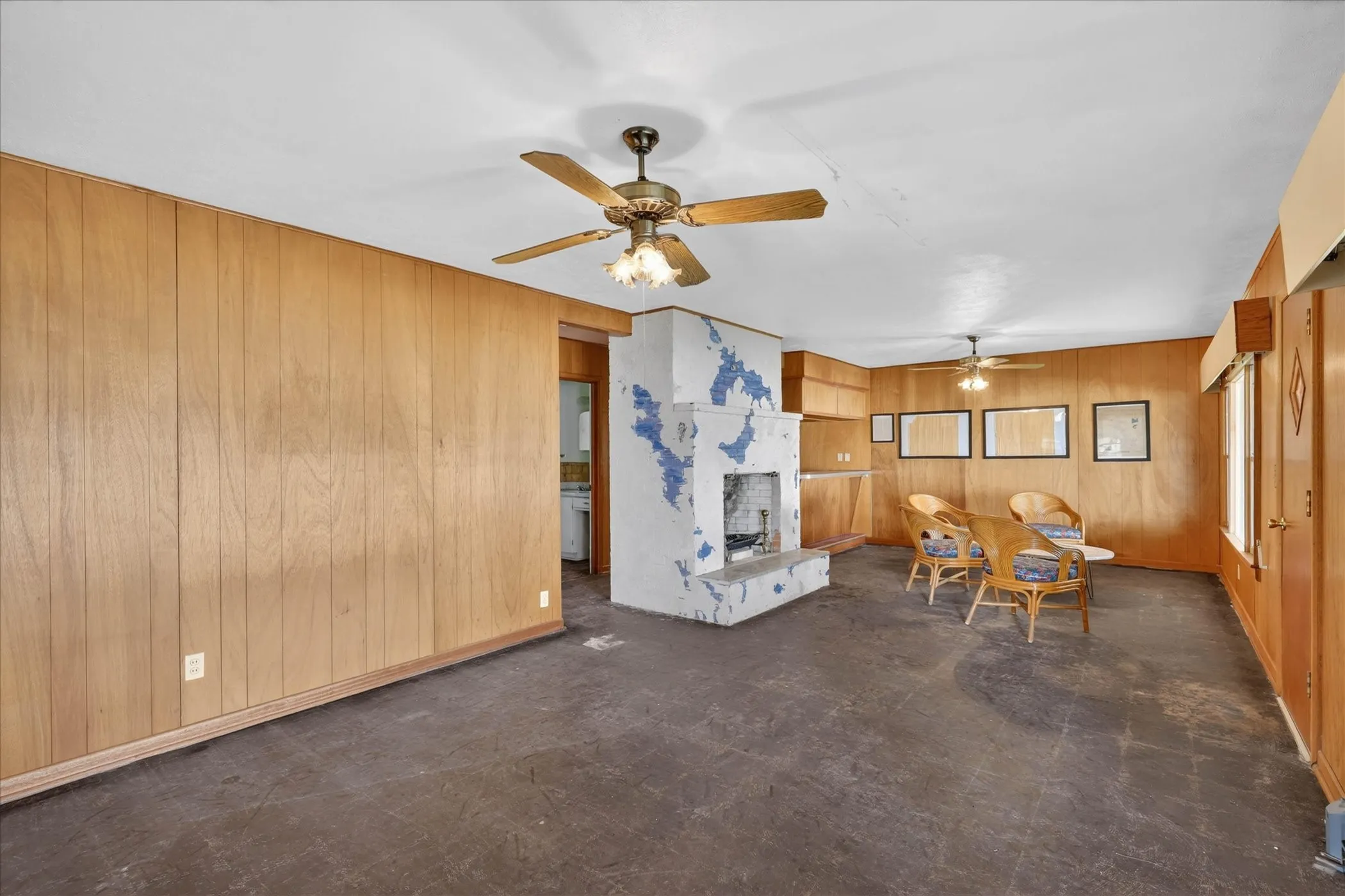 Spacious living and dining area with fireplace.