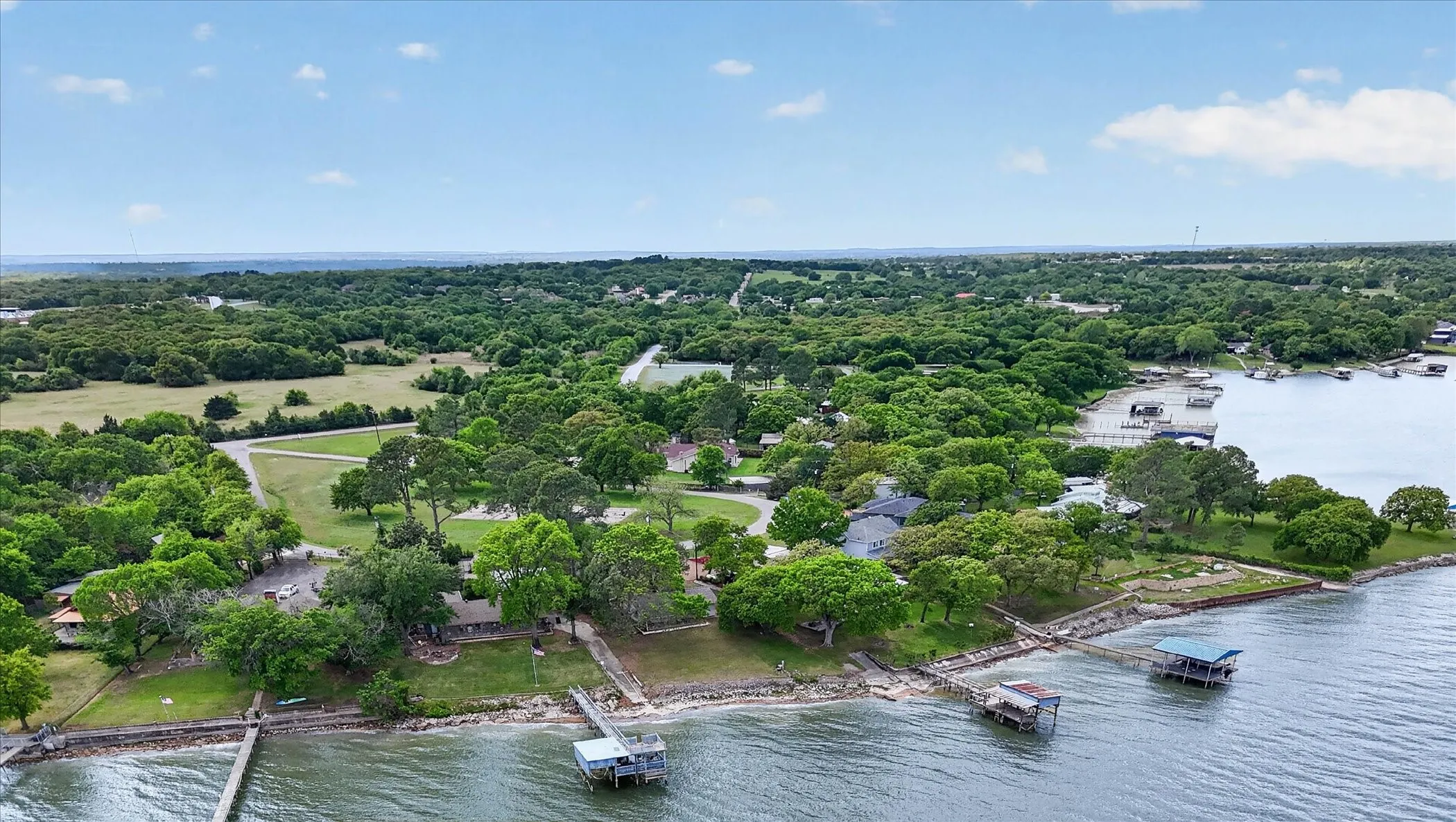 Bird's eye view of Eagle Mountain Lake and a tree filled landscape