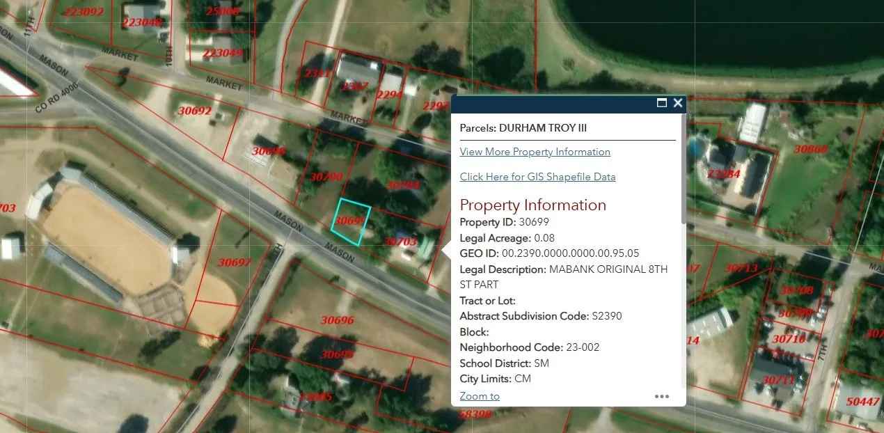 Aerial map of property and surrounding area featuring property boundaries highlighted