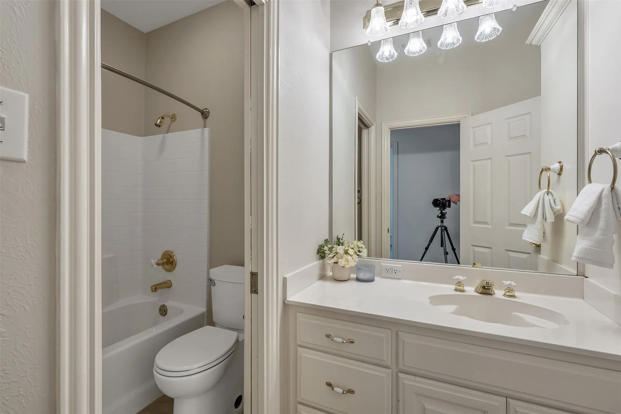 Full bath featuring vanity and washtub / shower combination