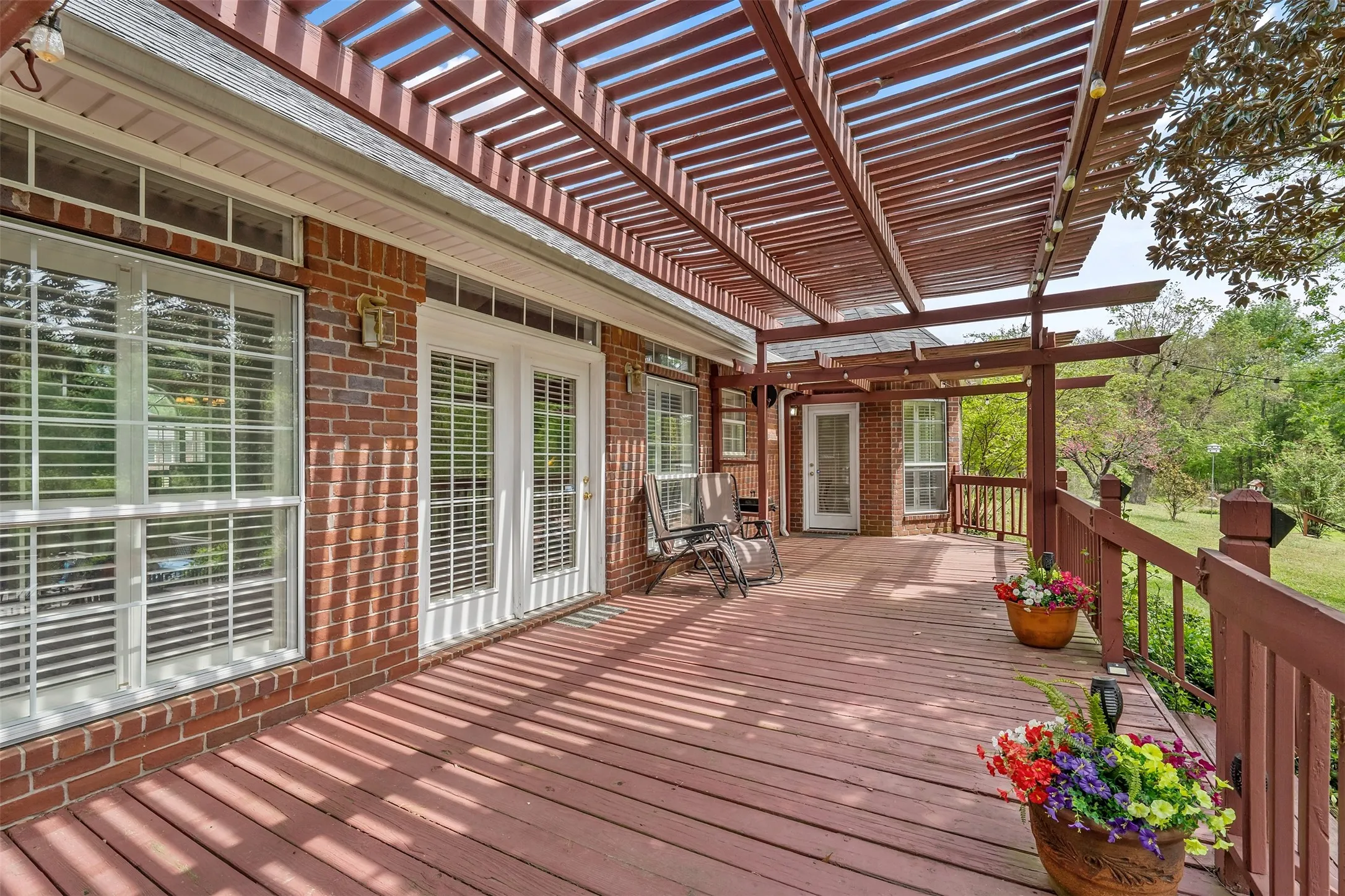 Wooden deck featuring a pergola