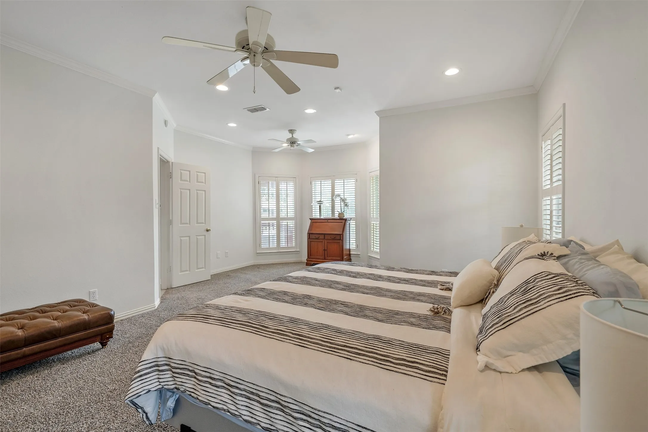 Bedroom with recessed lighting, ceiling fan, carpet flooring, and crown molding