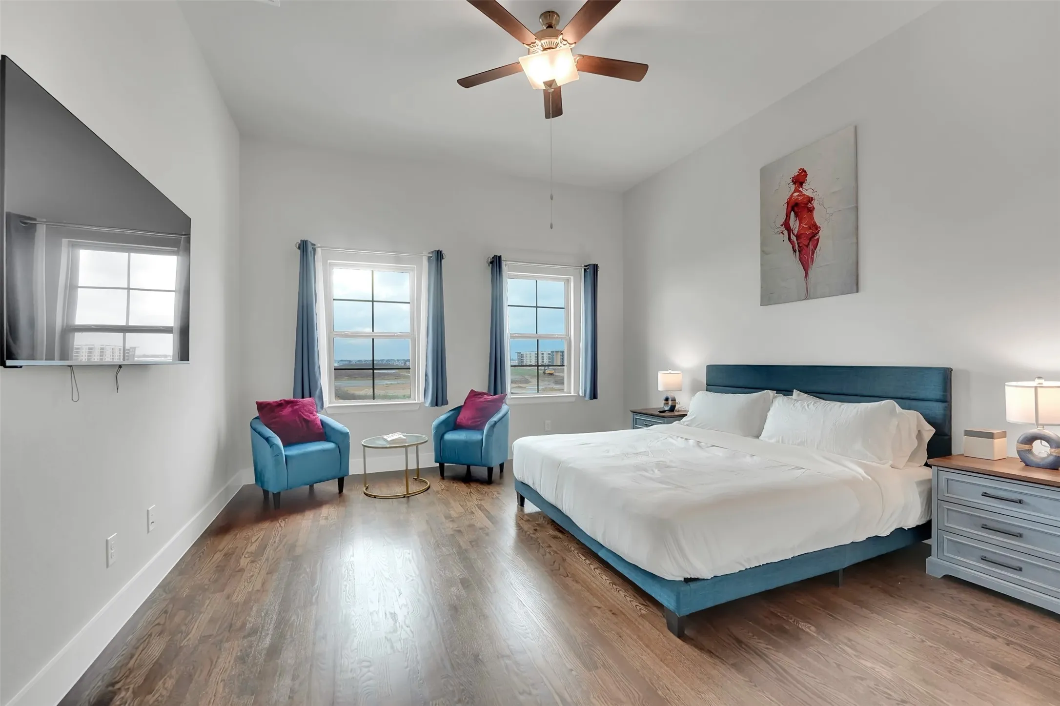 Bedroom featuring wood finished floors and ceiling fan