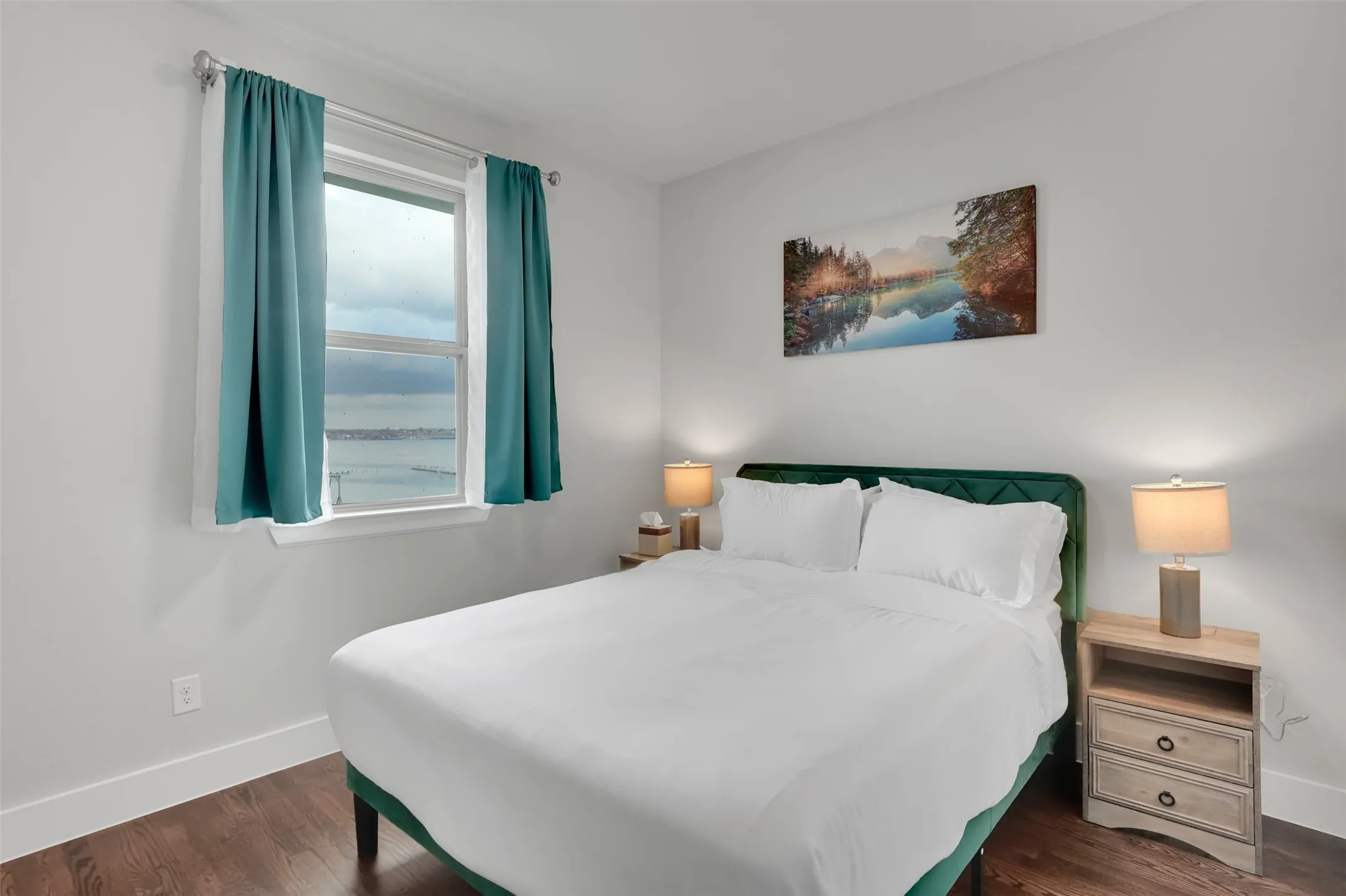 Bedroom featuring baseboards and dark wood-style floors