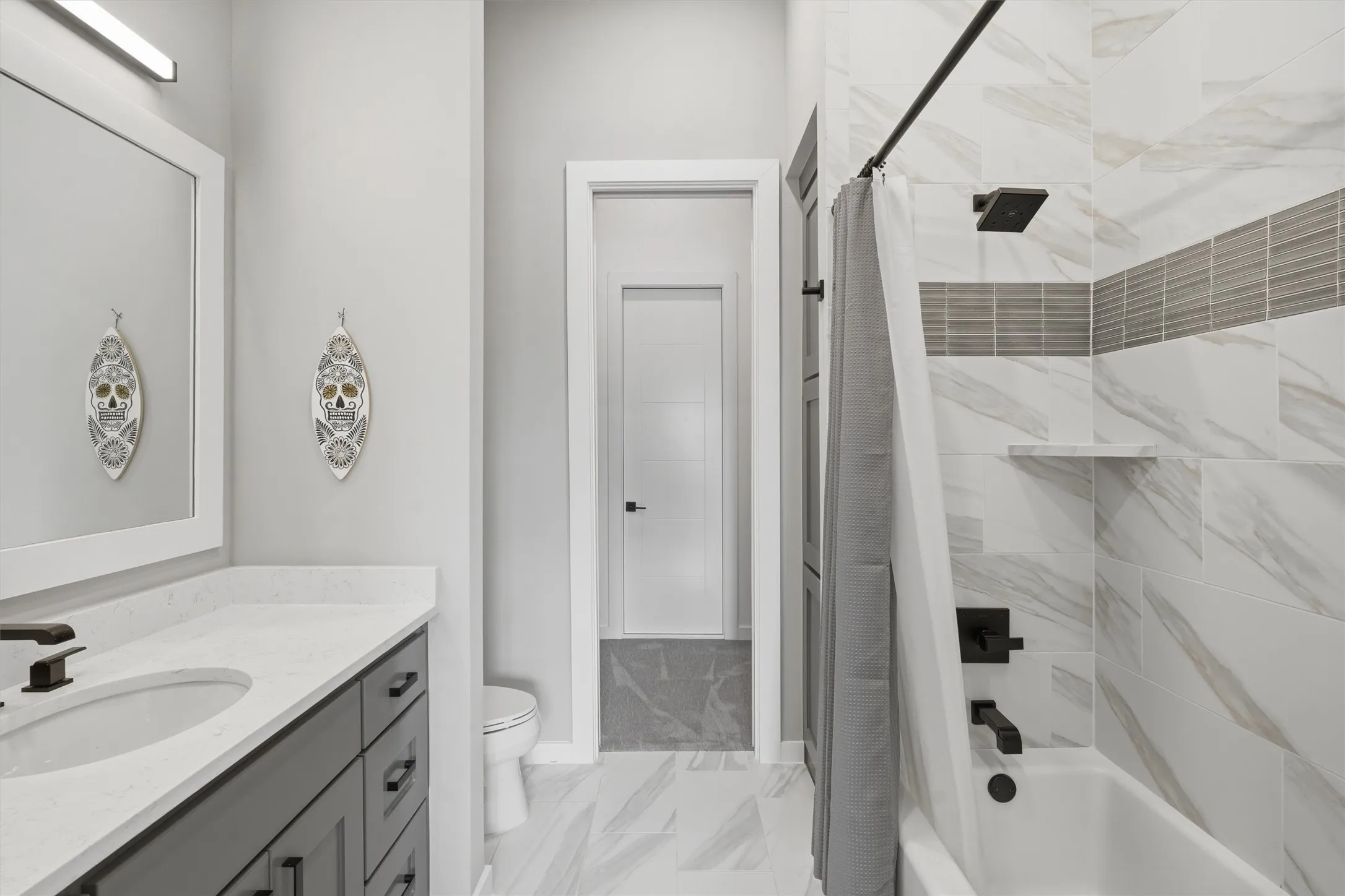 Bedroom 3 Bathroom featuring shower / bath combo, vanity, and walkin closet