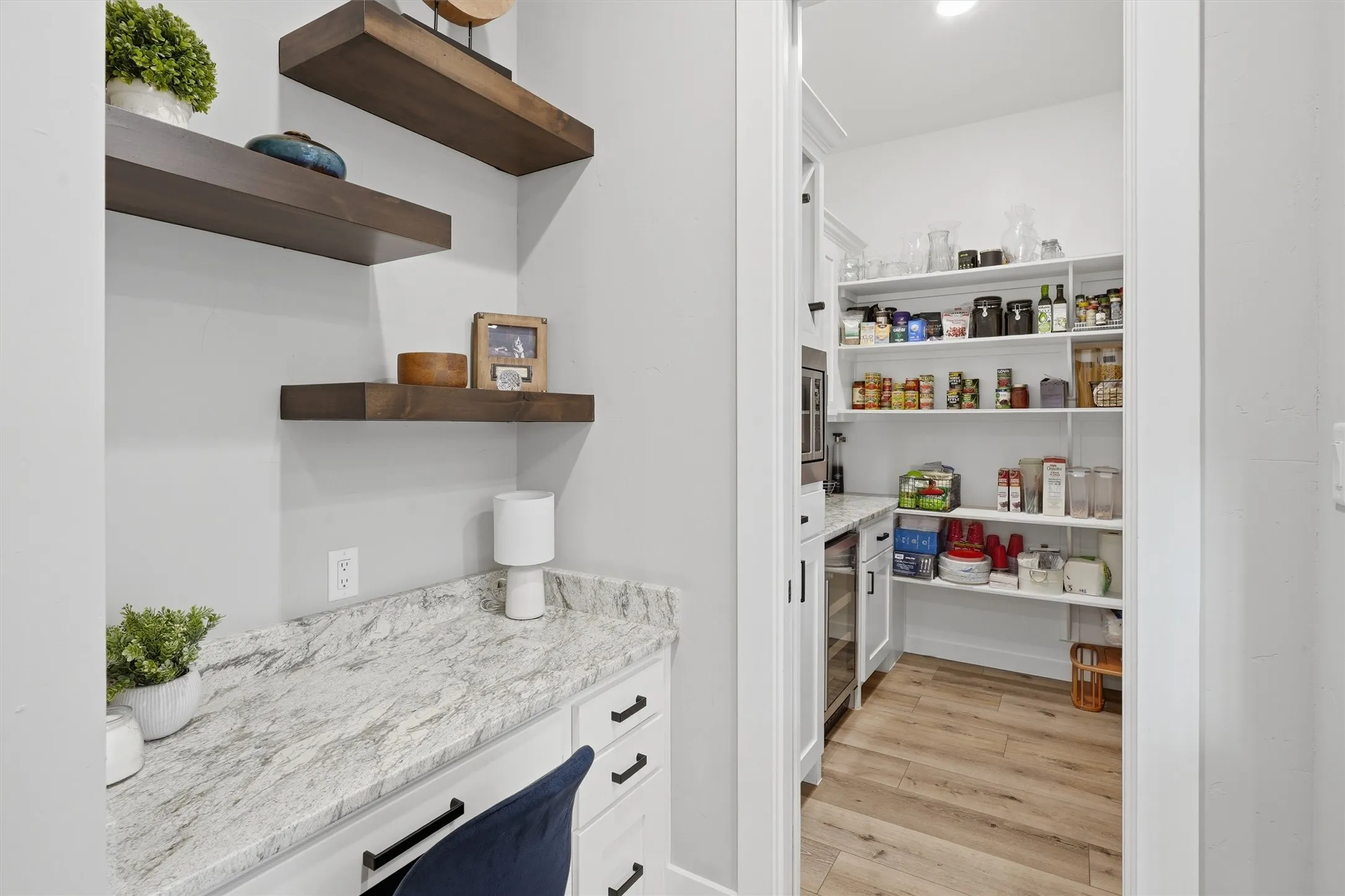 Walk in pantry area with wine cooler and office desk area