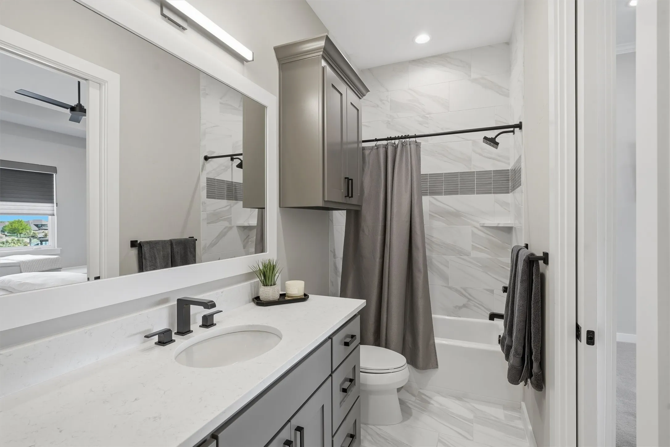 Bedroom 2 Ensuite bathroom with vanity, shower / bath combo, w walk in closet