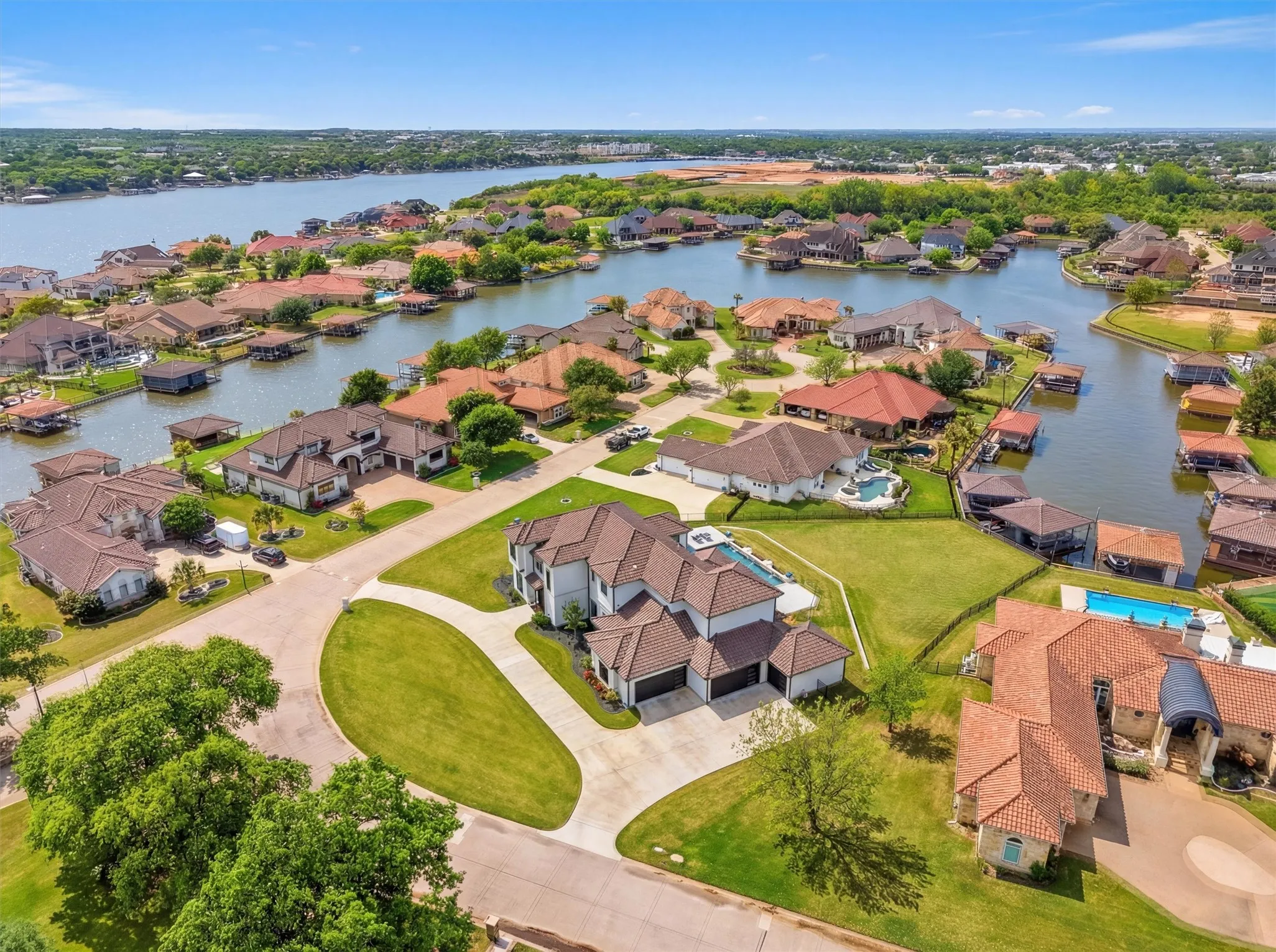 Aerial view of residential area and easy access to mainbody of lake.
