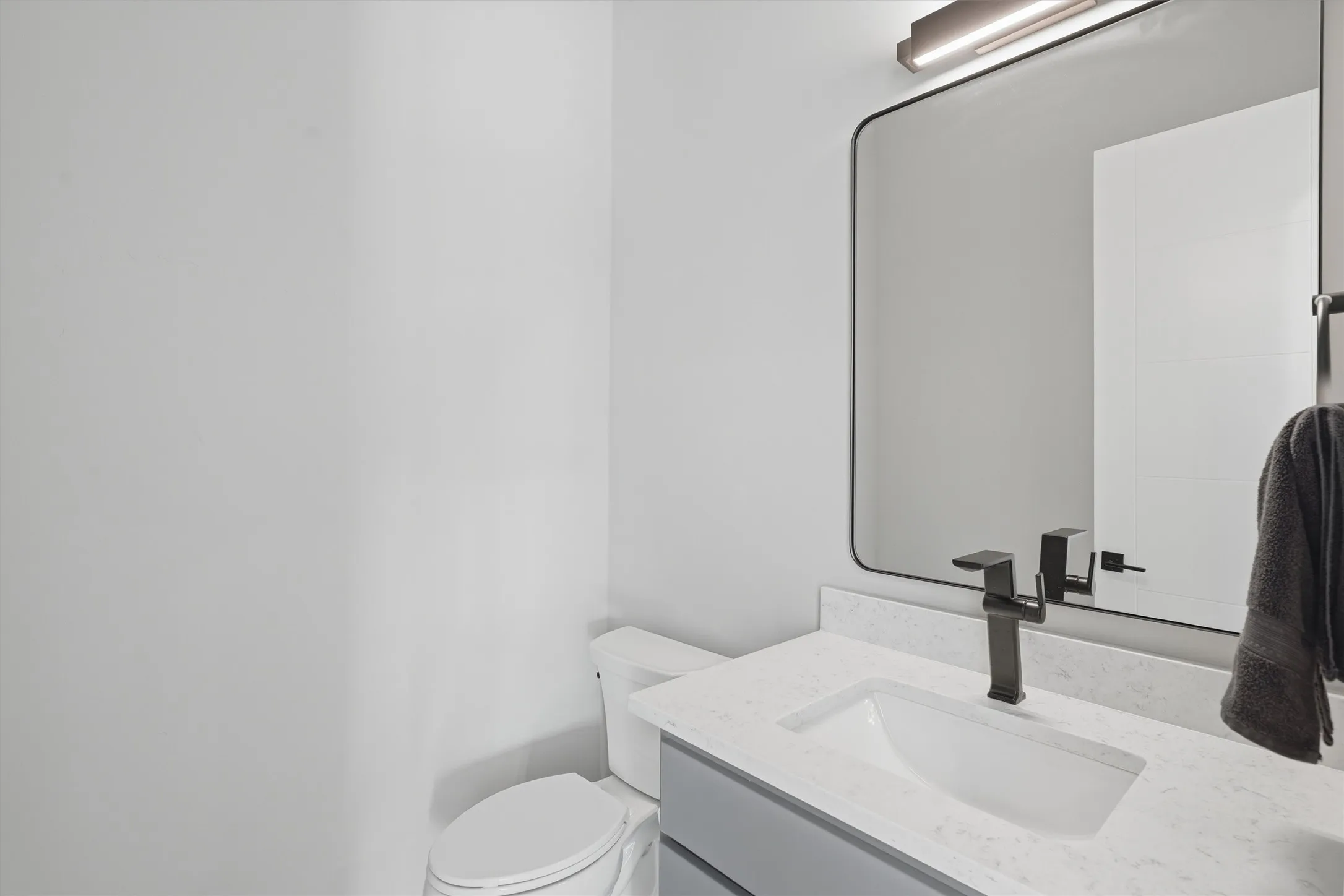 Half bath upstairs with toilet and vanity