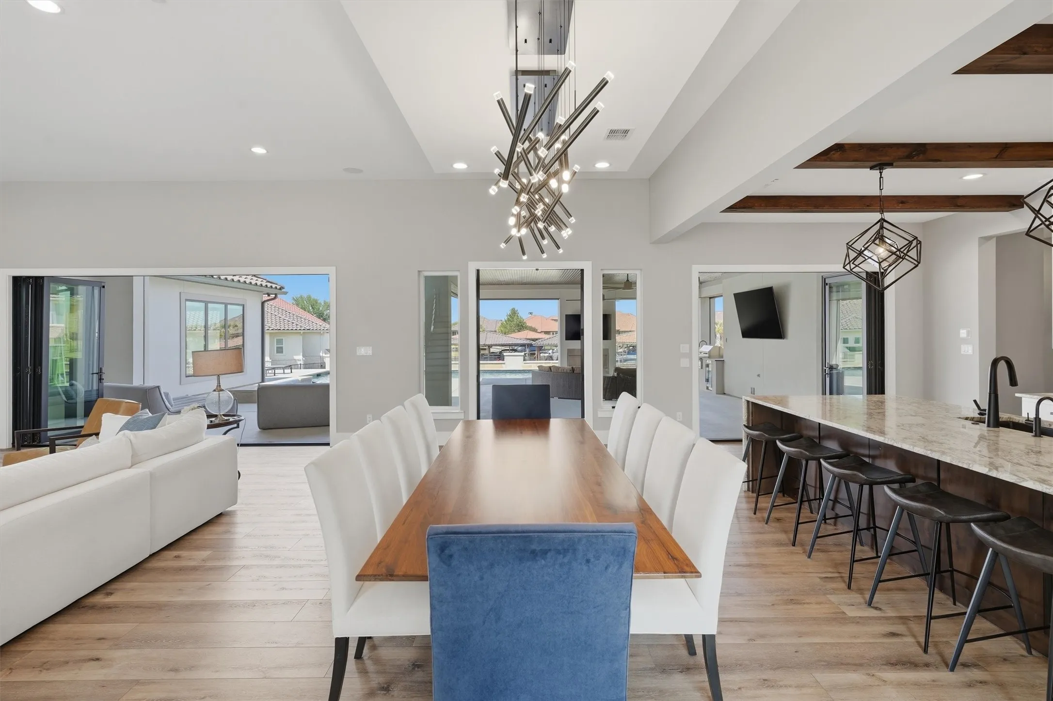 Folding glass doors expands the living area onto the pool patio area.