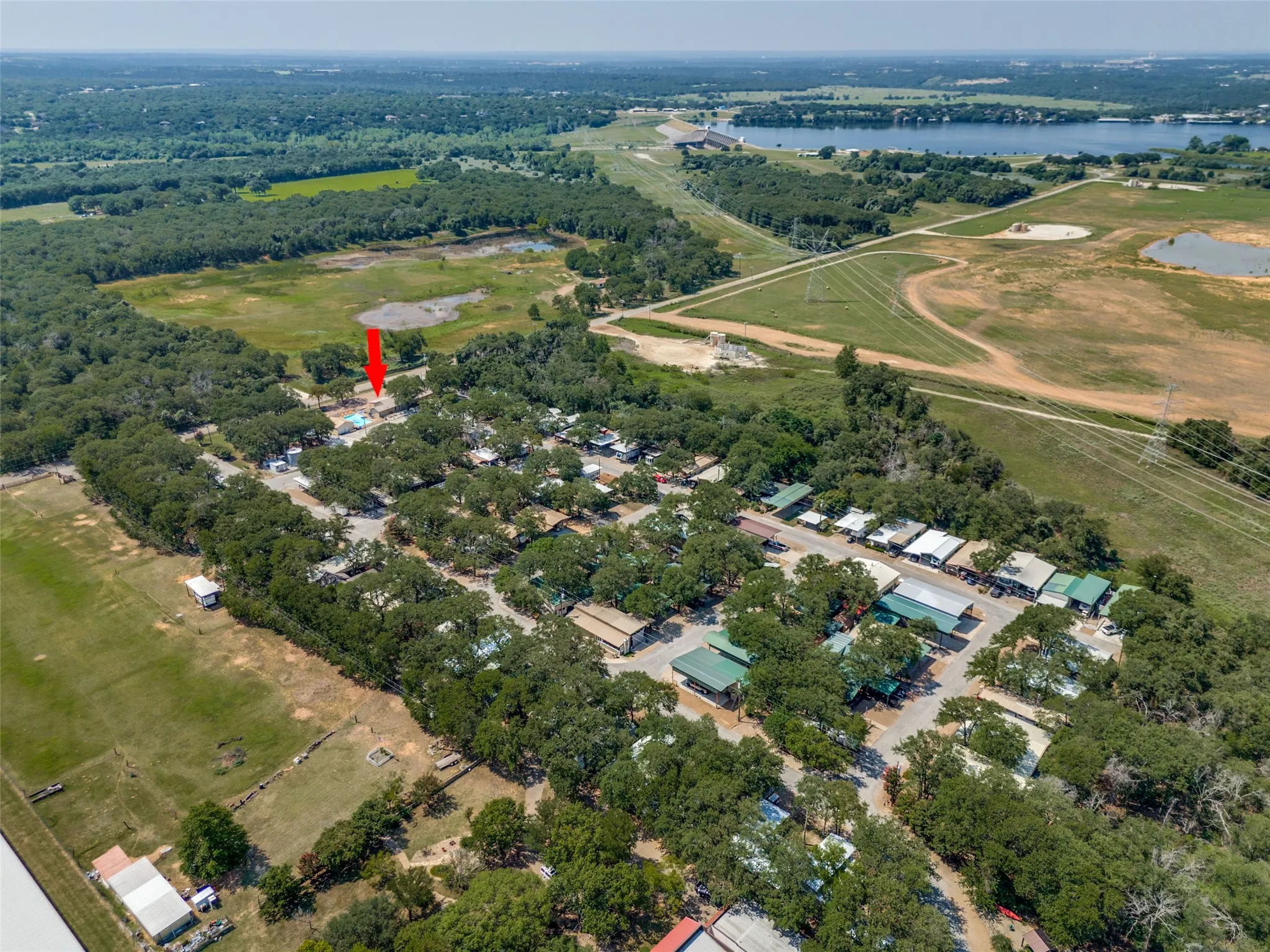 Aerial view of property's location featuring a large body of water