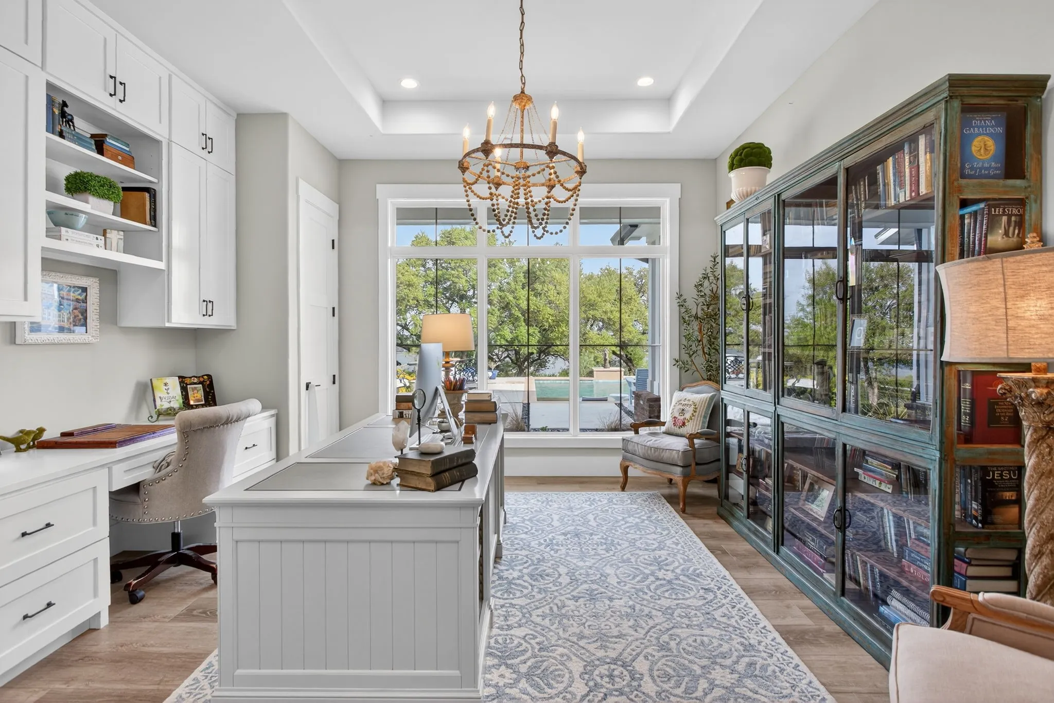 There are TWO executive offices in this home. This one faces the back and captures the views.