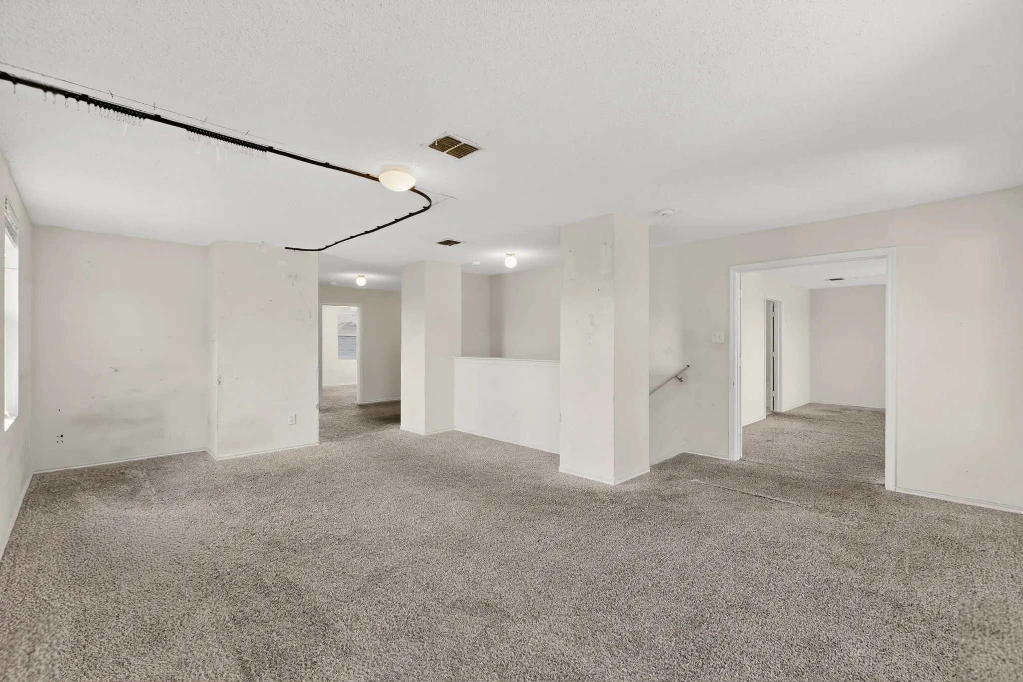 Spare room featuring carpet