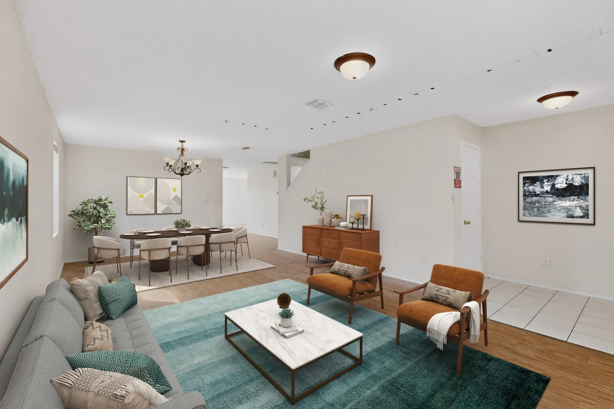 Living room featuring light wood-style flooring and a chandelier