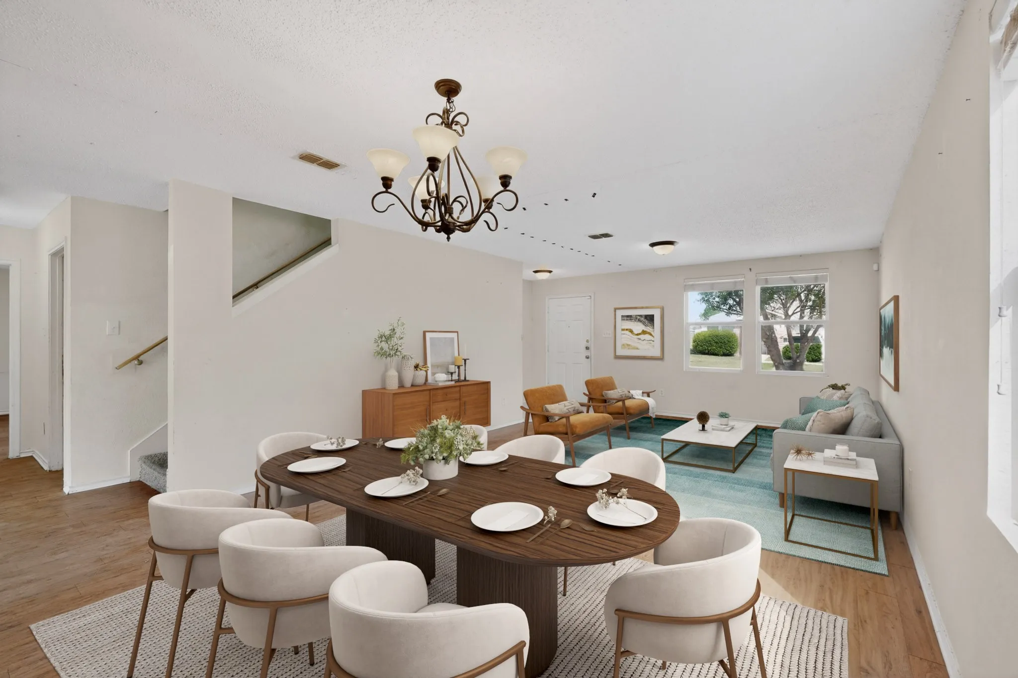 Dining space featuring light wood-style flooring and a chandelier