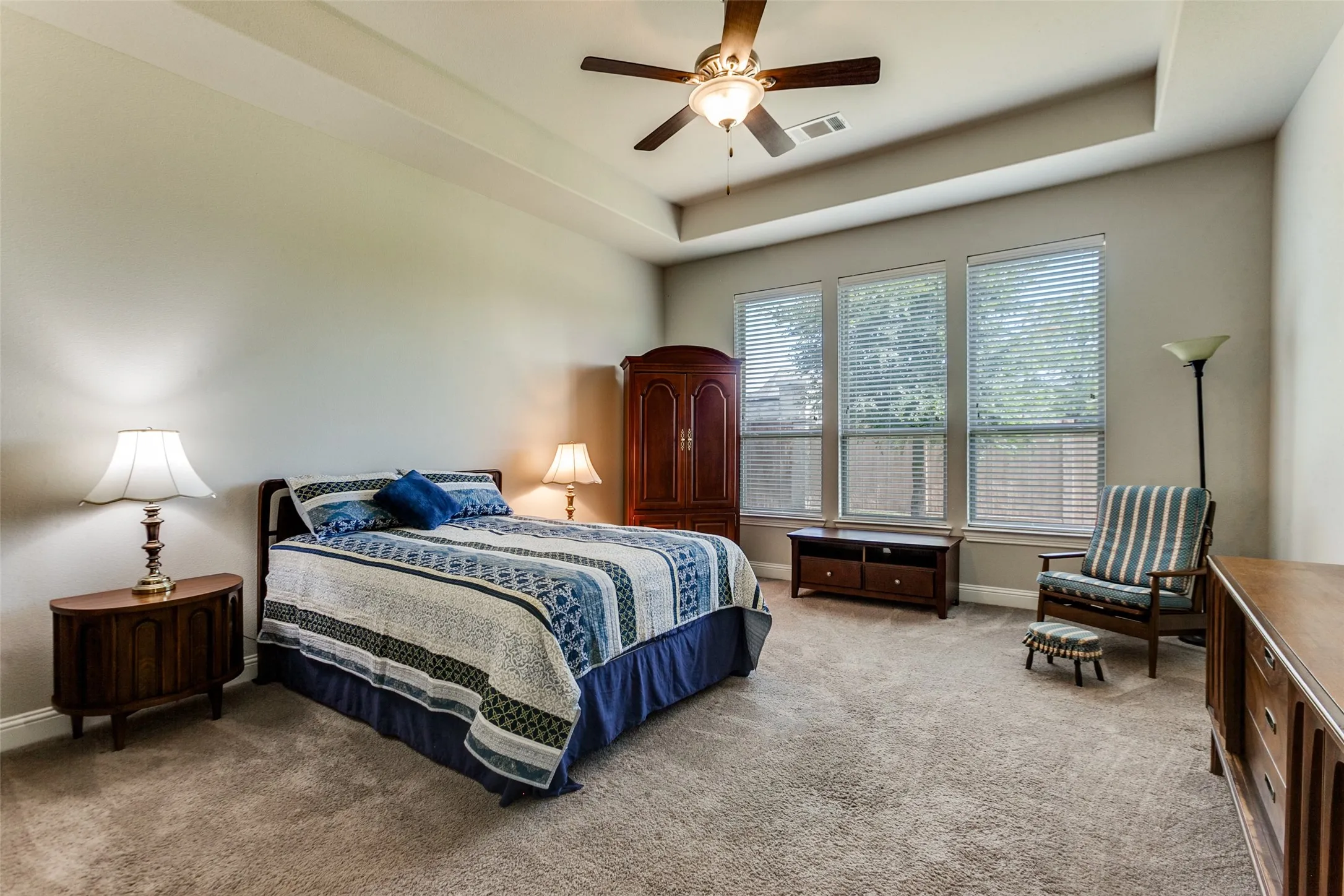 Roomy Primary Bedroom with view of back yard