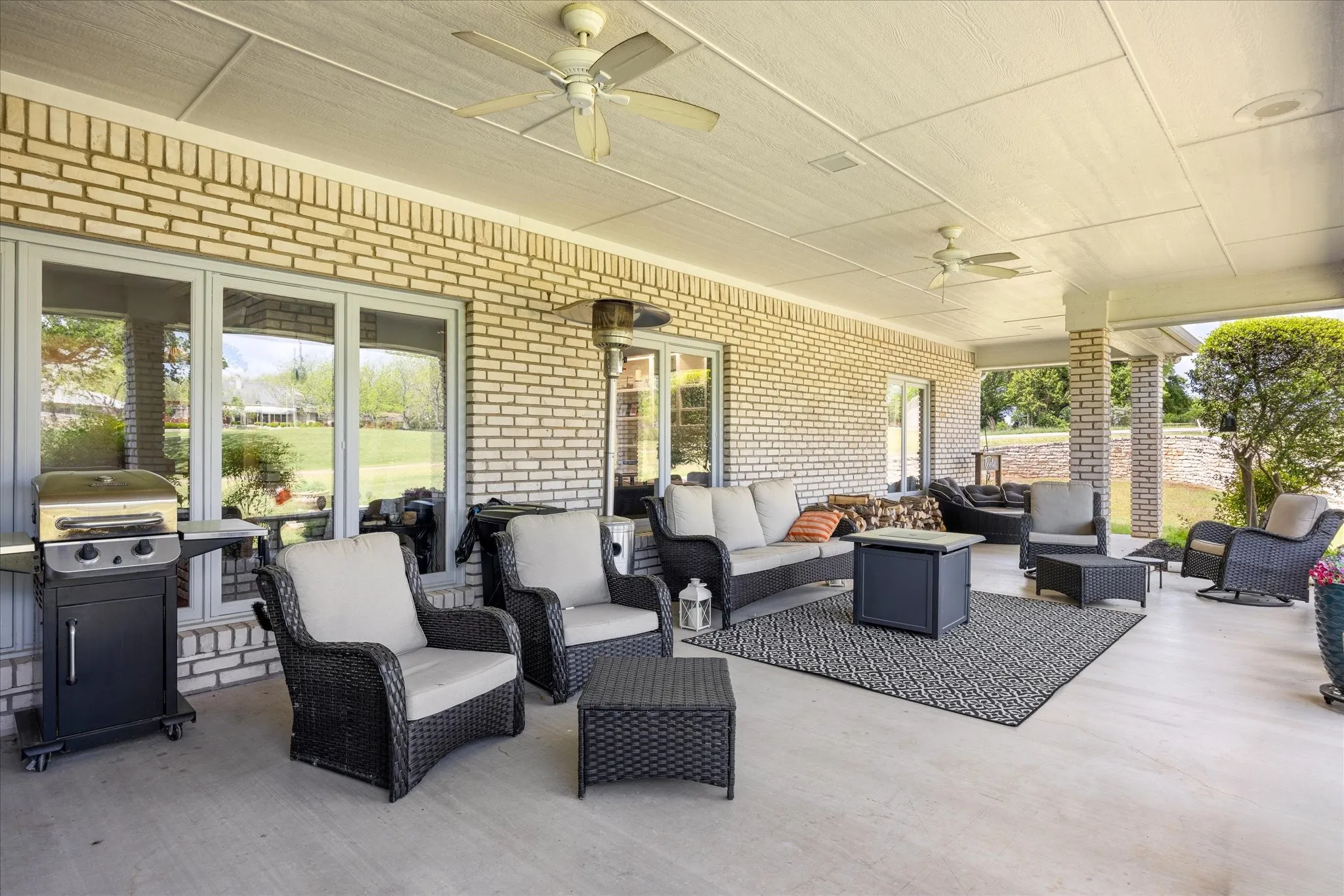 View of patio / terrace with a ceiling fan, grilling area, and outdoor seating