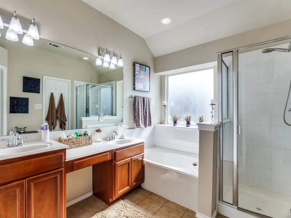 Bathroom featuring double vanity, large tub!