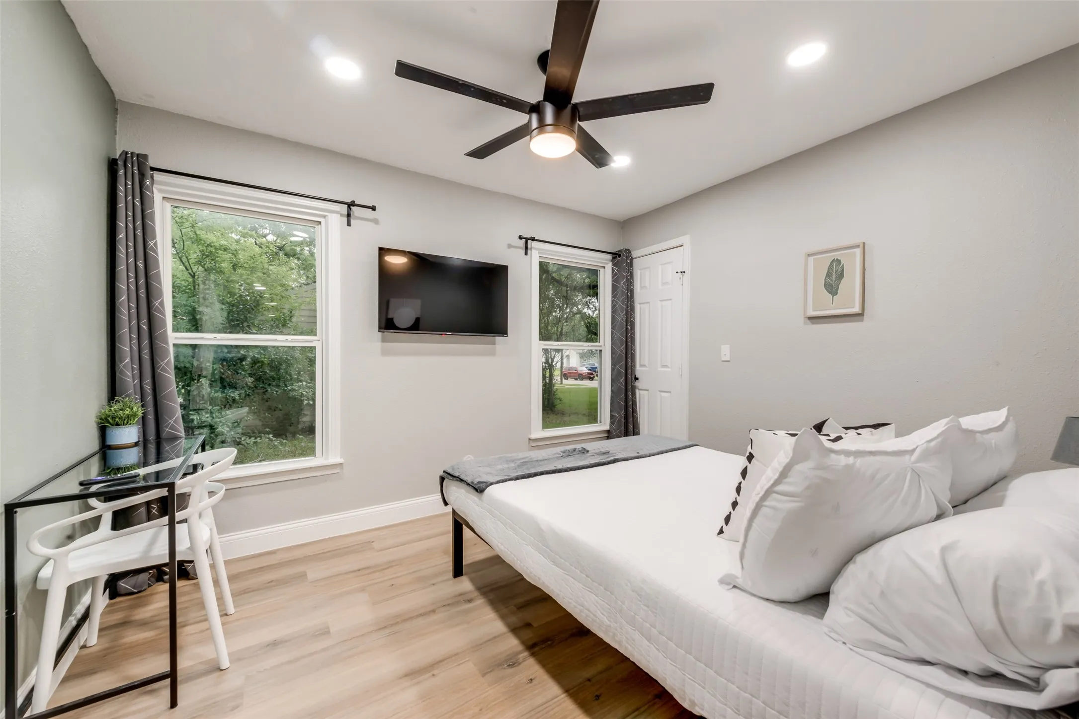 Bedroom featuring light wood finished floors, recessed lighting, and a ceiling fan