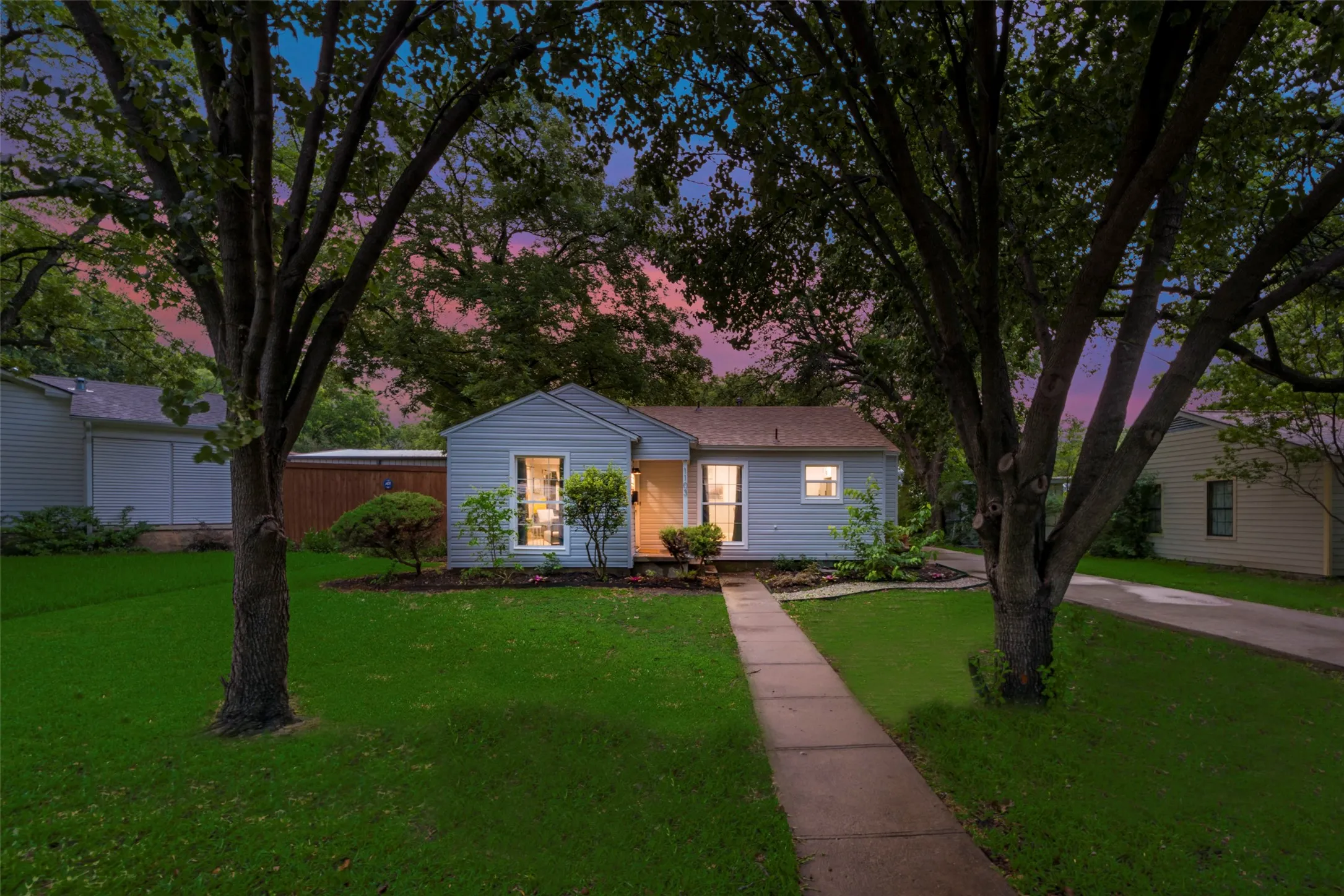 View of front of property featuring a lawn