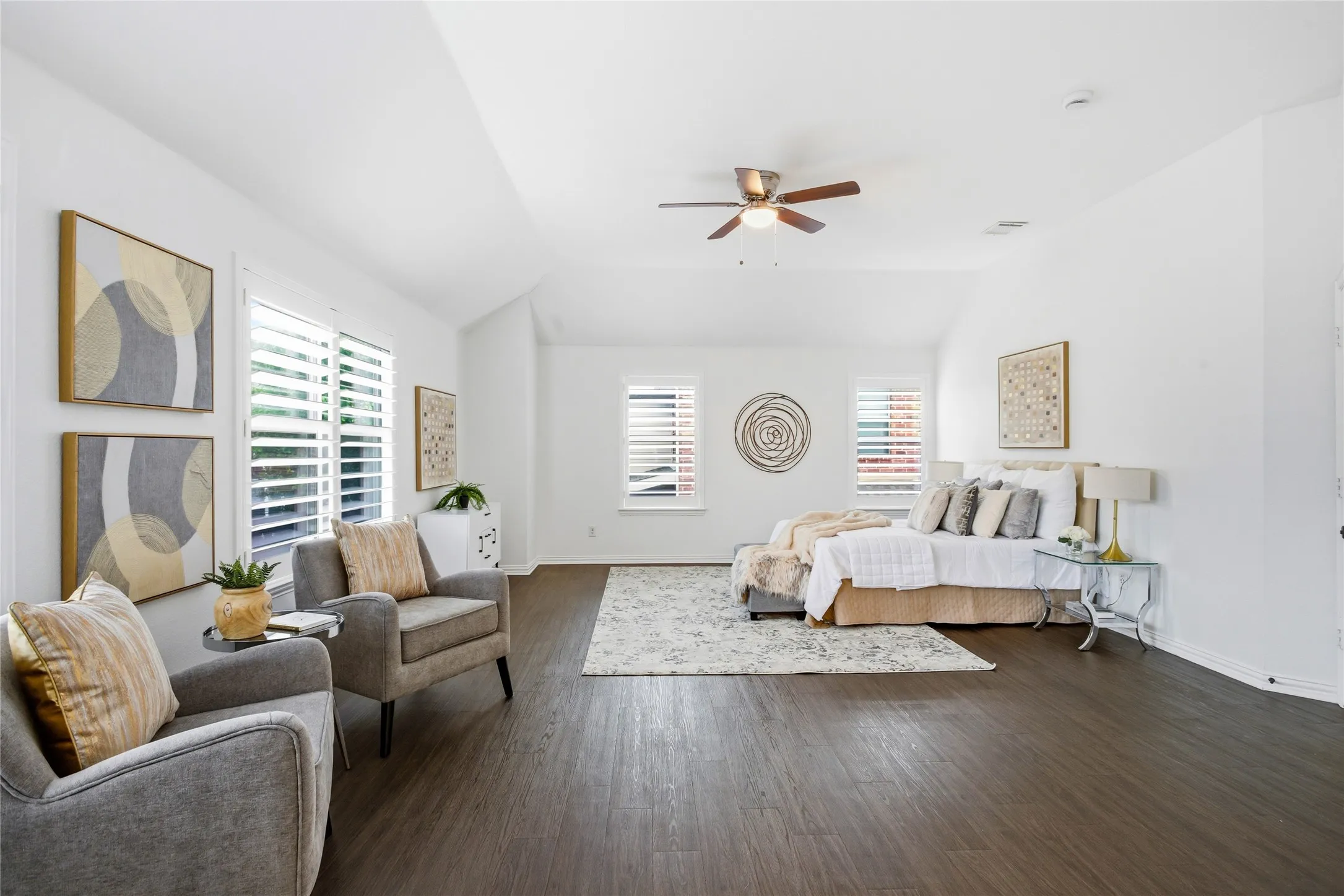 Primary bedroom has plenty of room for a sitting area or office area. The primary bedroom is very grand.