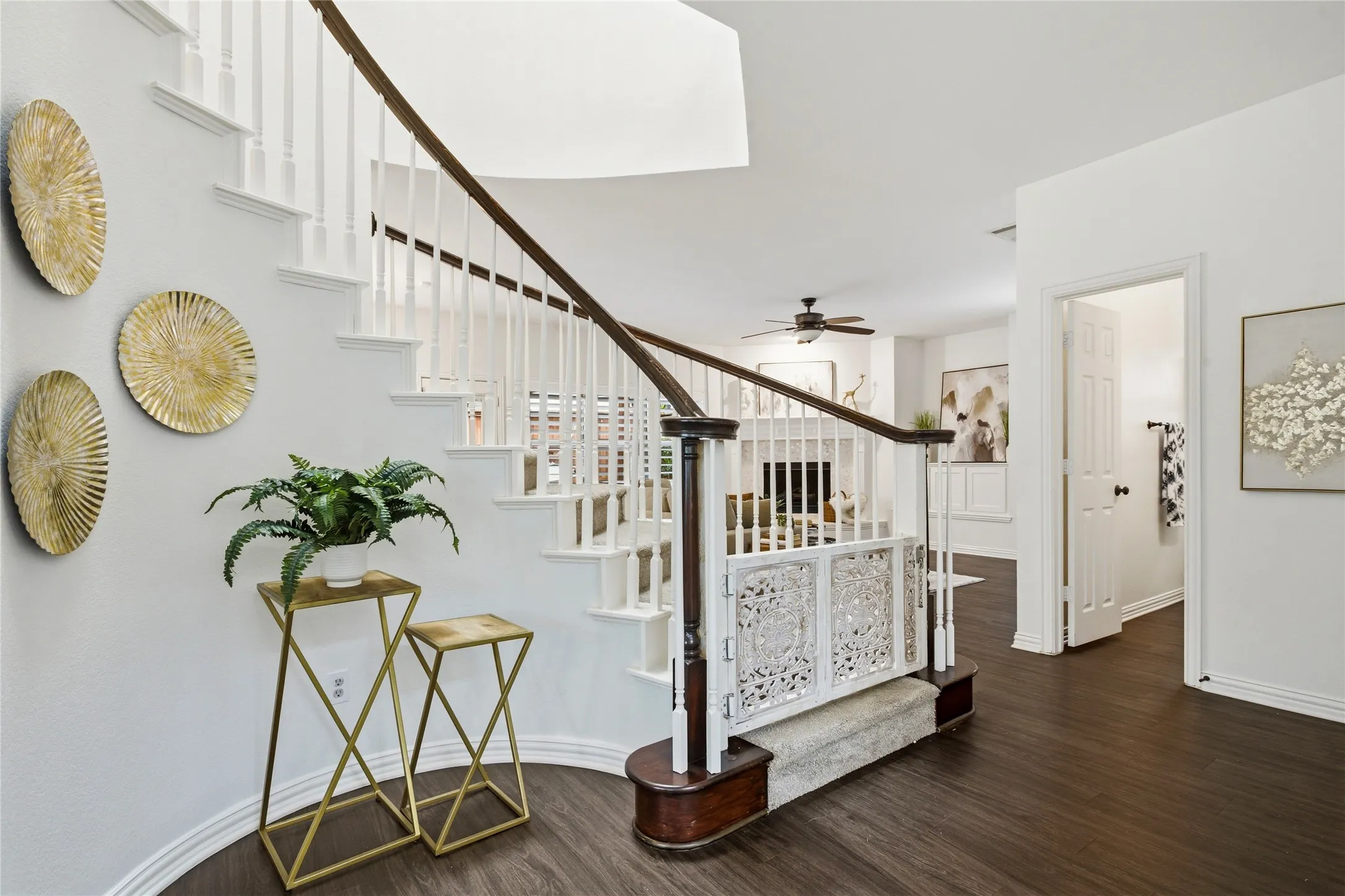 Home features stunning architectural curved walls. throughout. Gate has been removed at bottom of staircase.