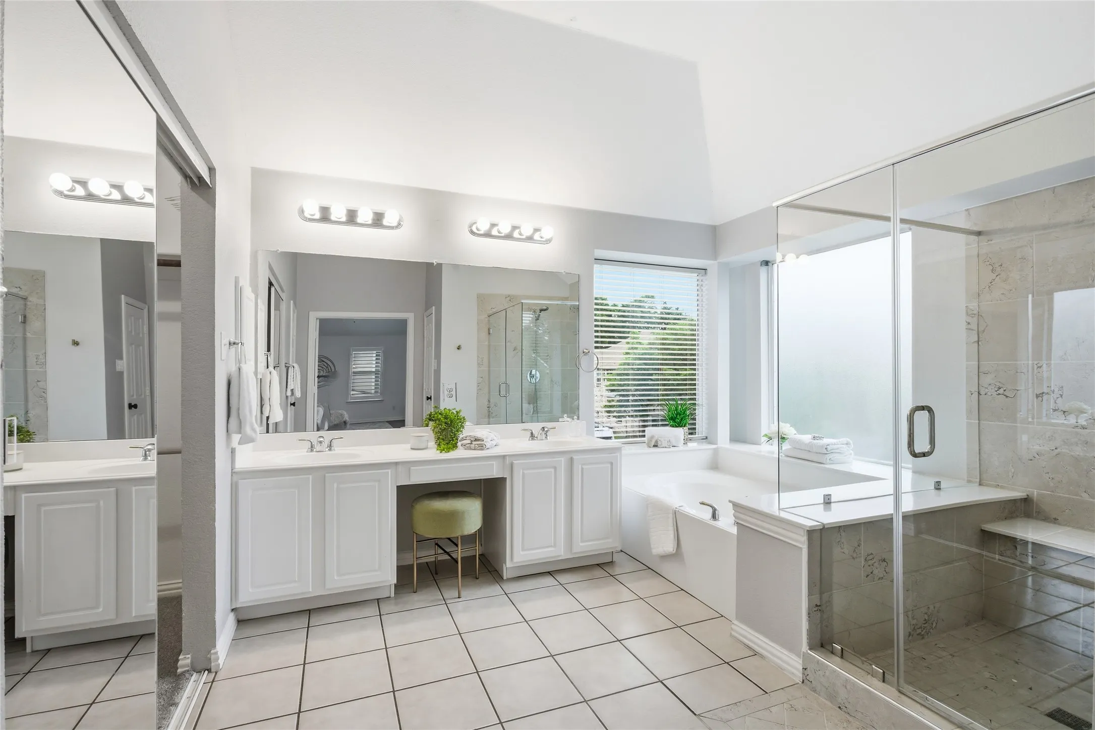 Primary bathroom has a nice size garden tub surrounded by windows for natural light. Great for relaxing after a long day.