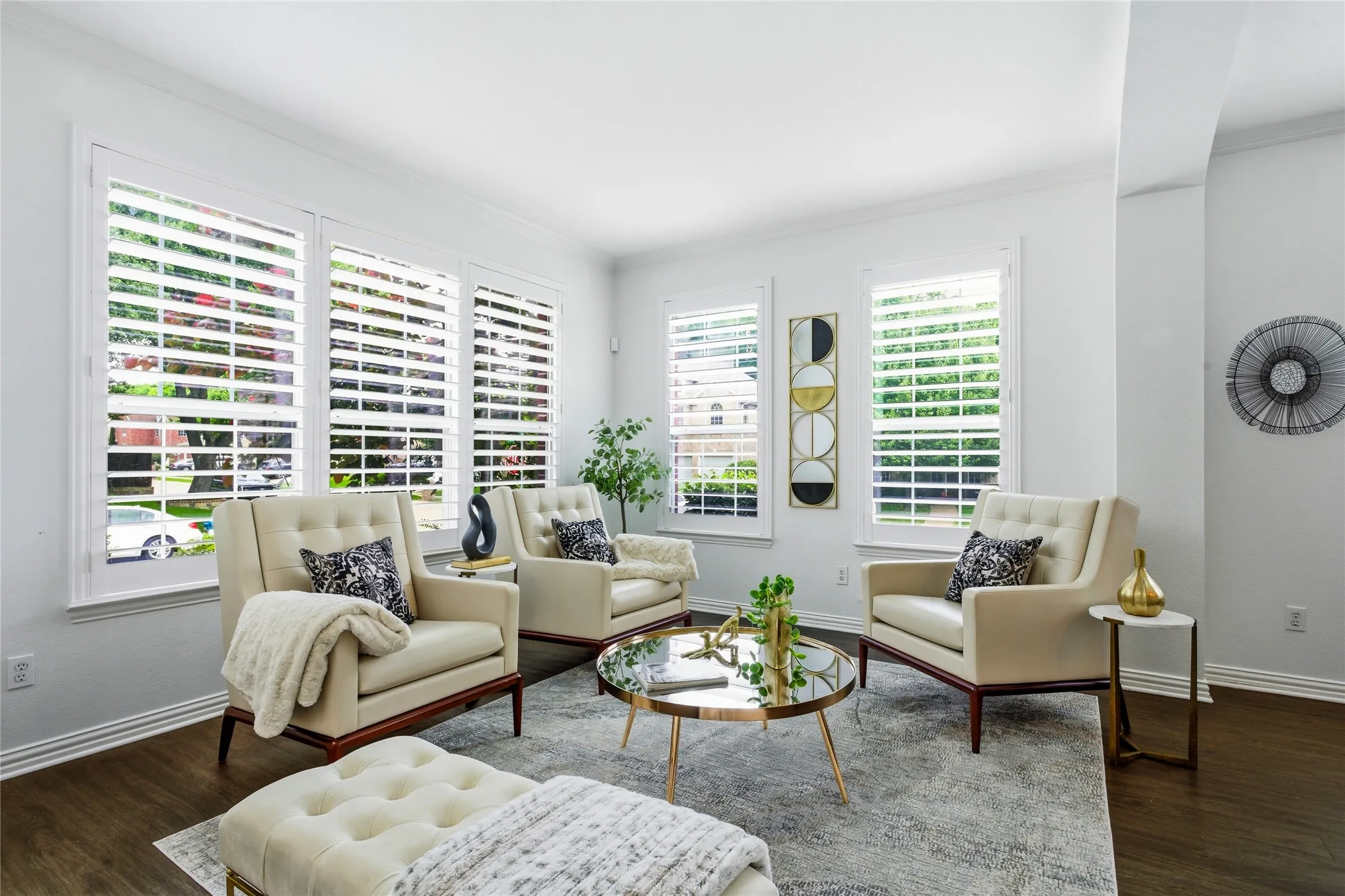 Formal living area upon entry. This home has tons of natural light streaming in. Wooden custom shutters on windows throughout the home.