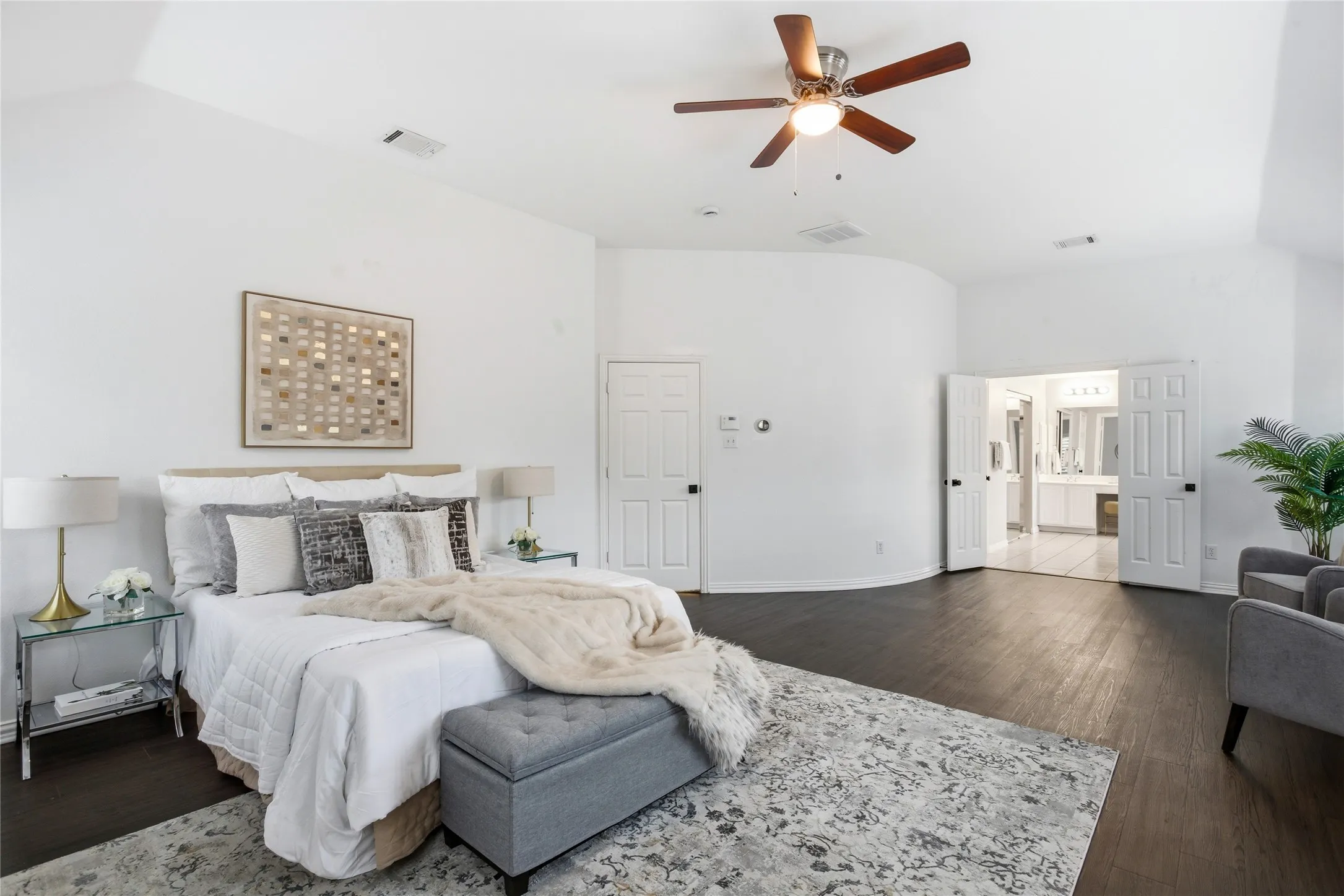 The primary bedroom is exceptionally large with a beautiful curved accent wall. Gives it a metropolitan vibe.