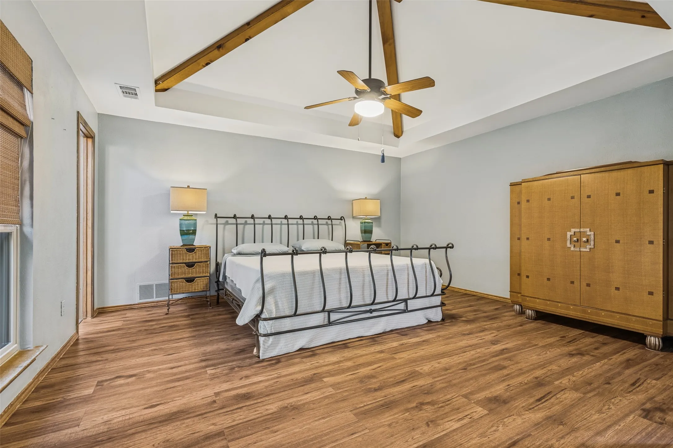 Primary Bedroom with Vinyl Plank flooring and ceiling fan.